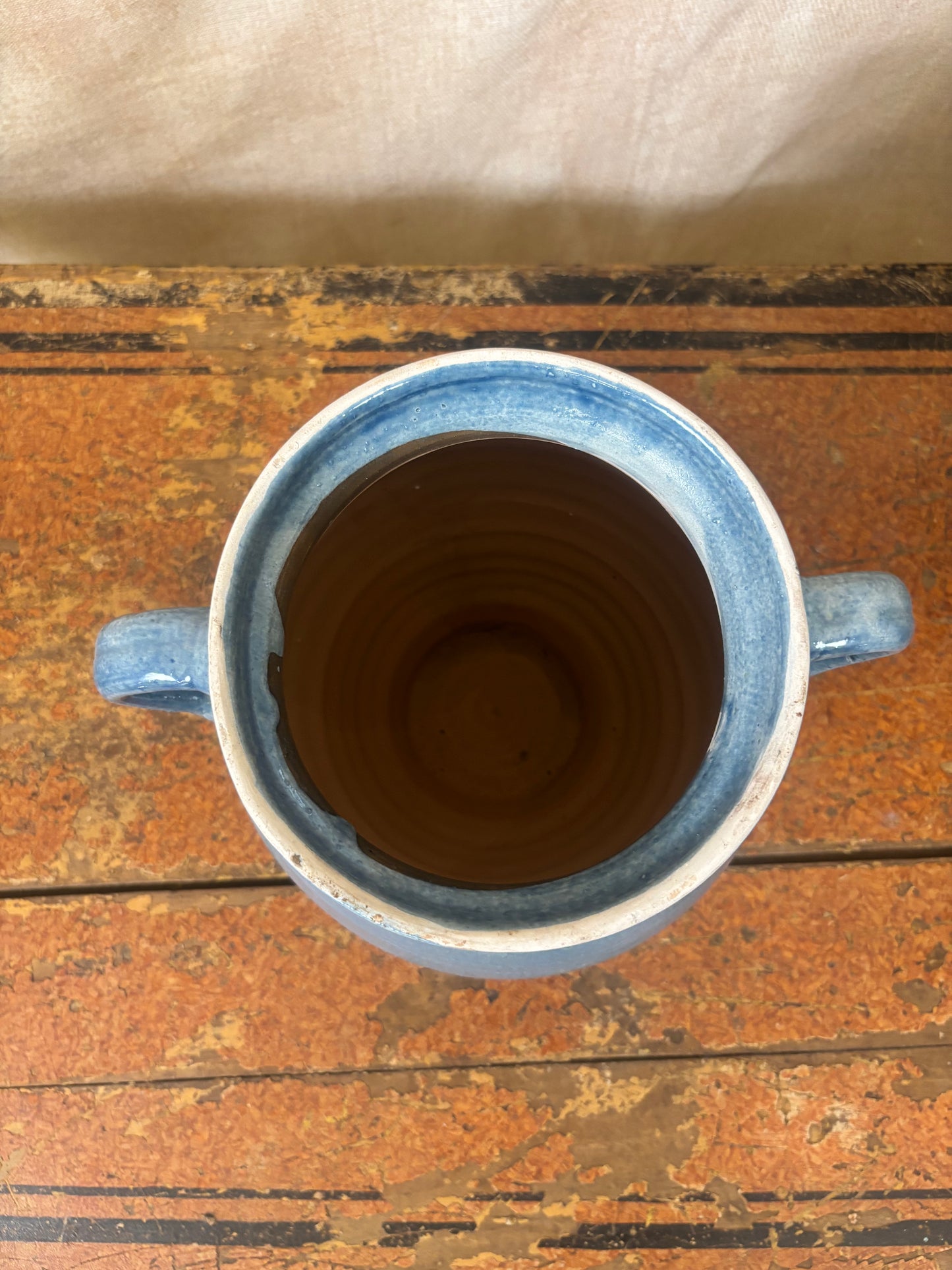 Blue ceramic mug on a wooden surface