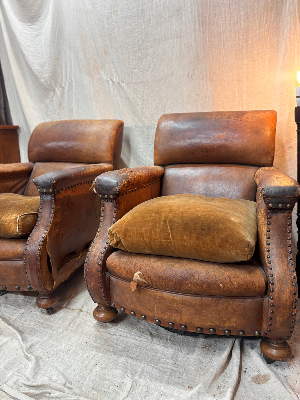 A Pair of Brown Leather Club Chairs.