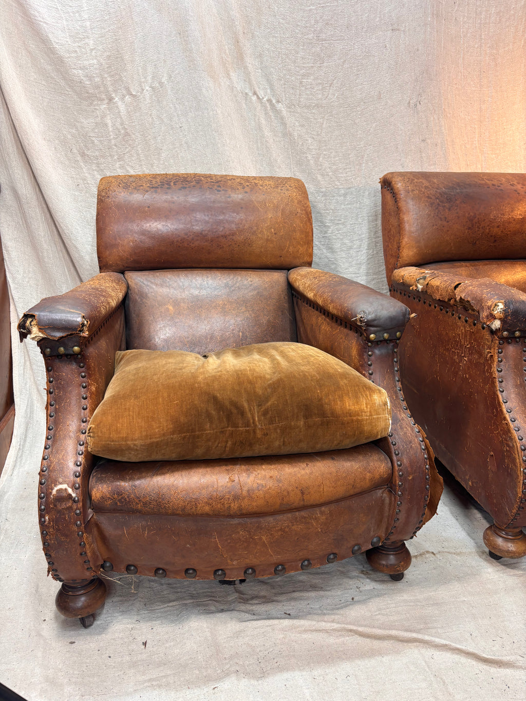 A Pair of Brown Leather Club Chairs.