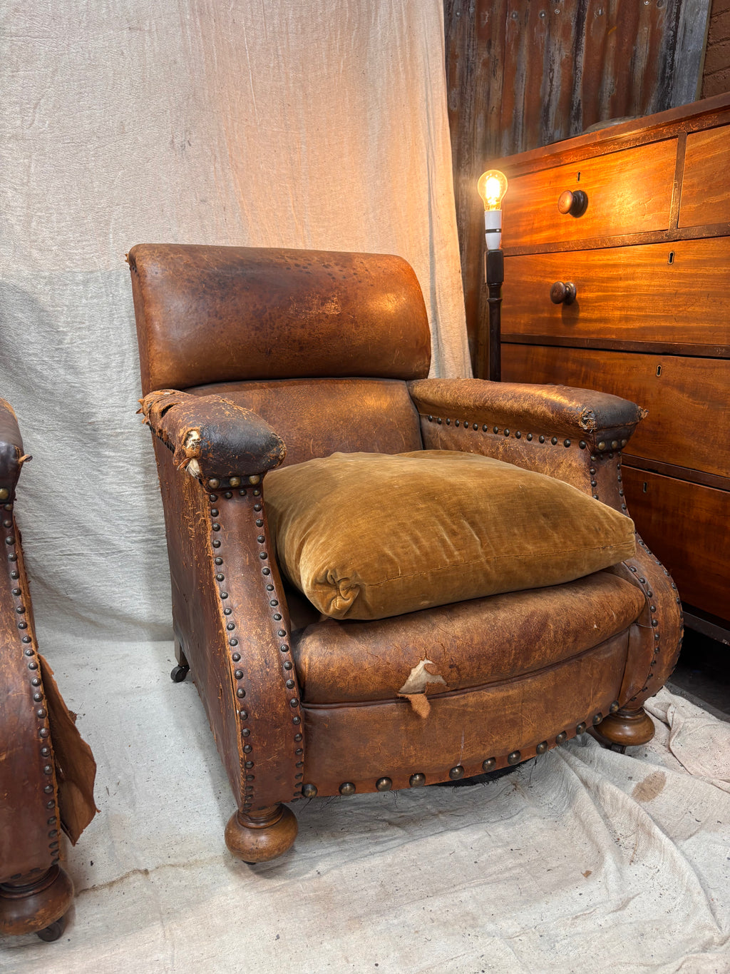 A Pair of Brown Leather Club Chairs.