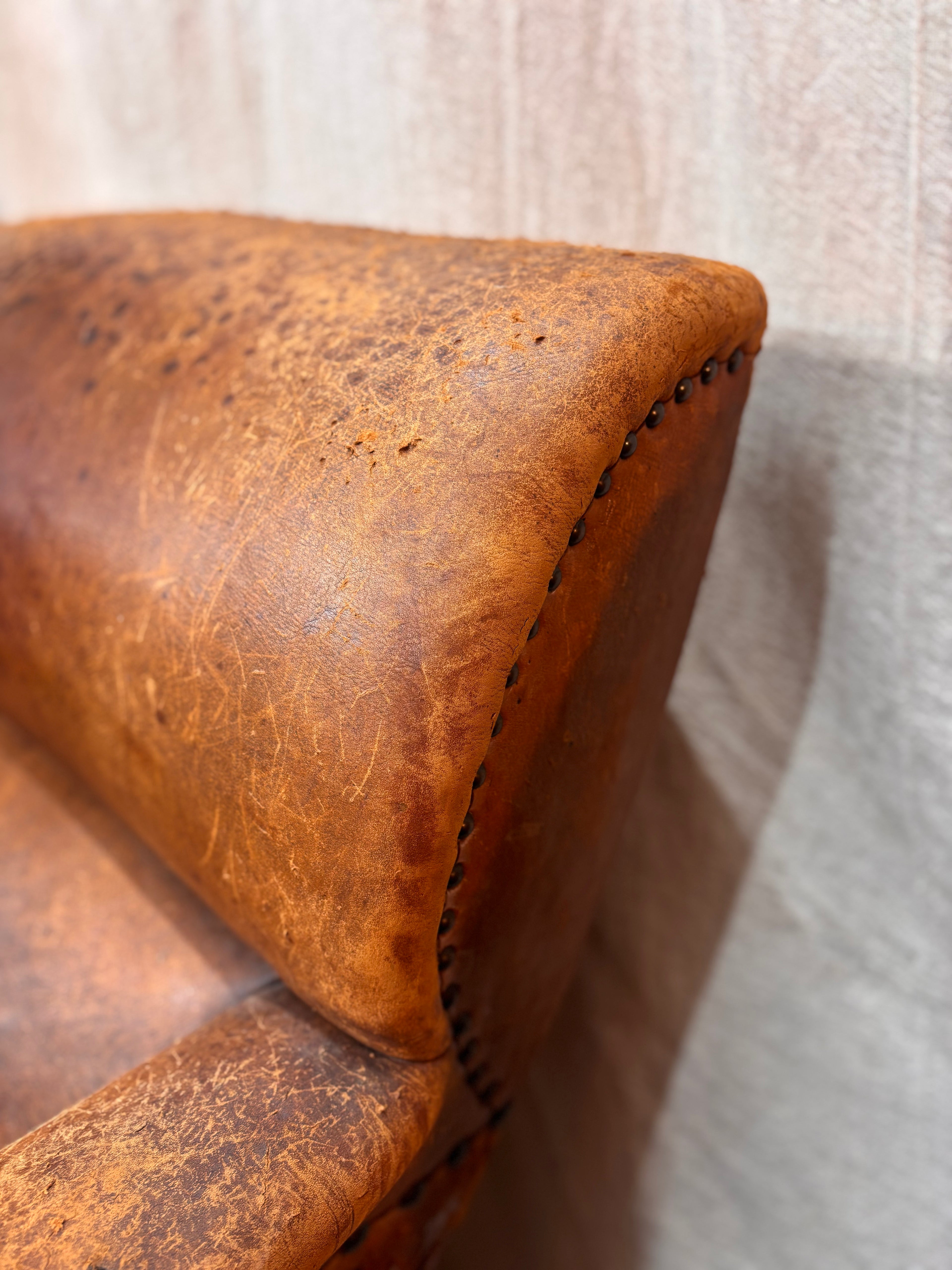 A Pair of Brown Leather Club Chairs.