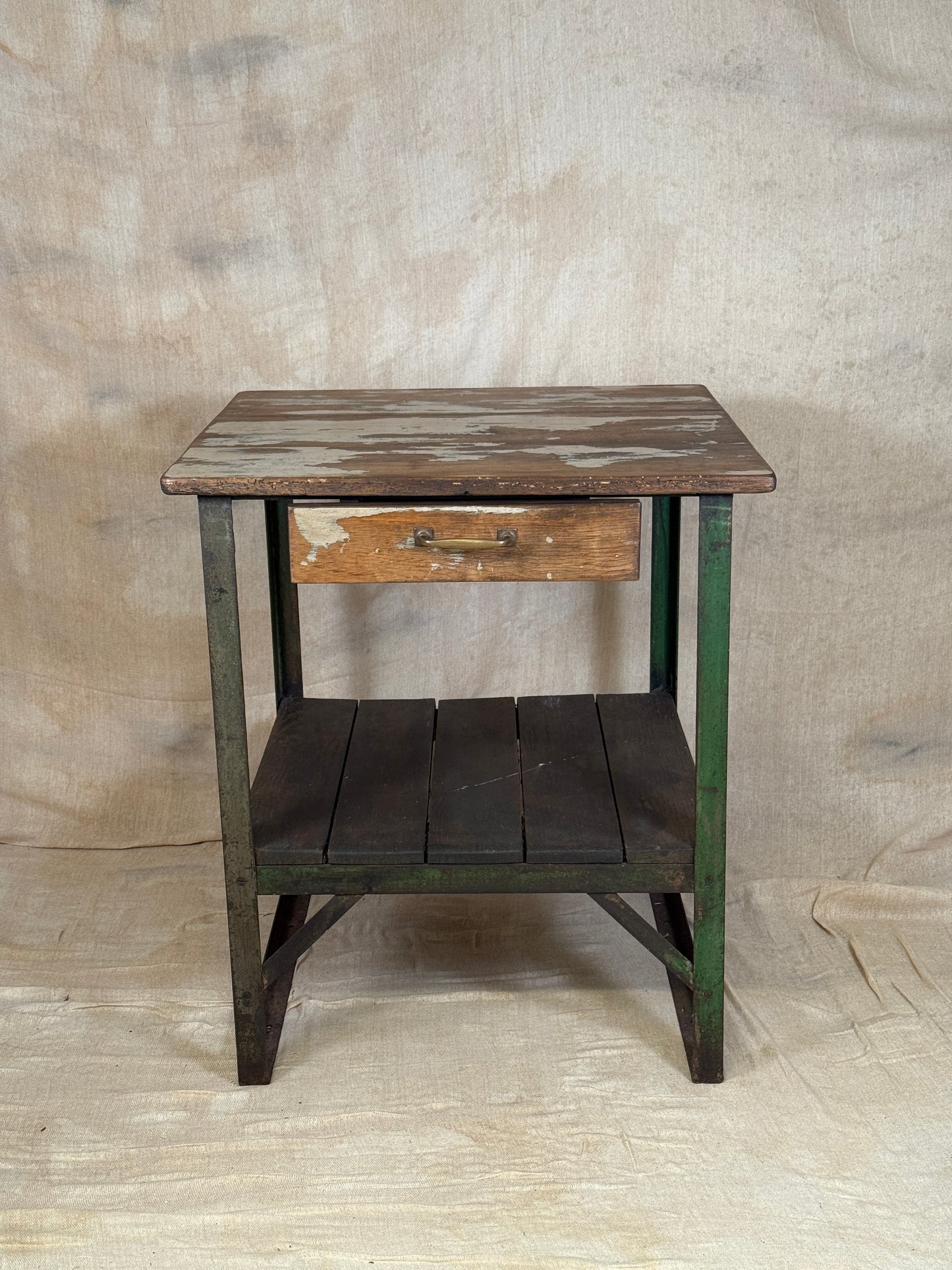 A rustic industrial wooden and metal table.