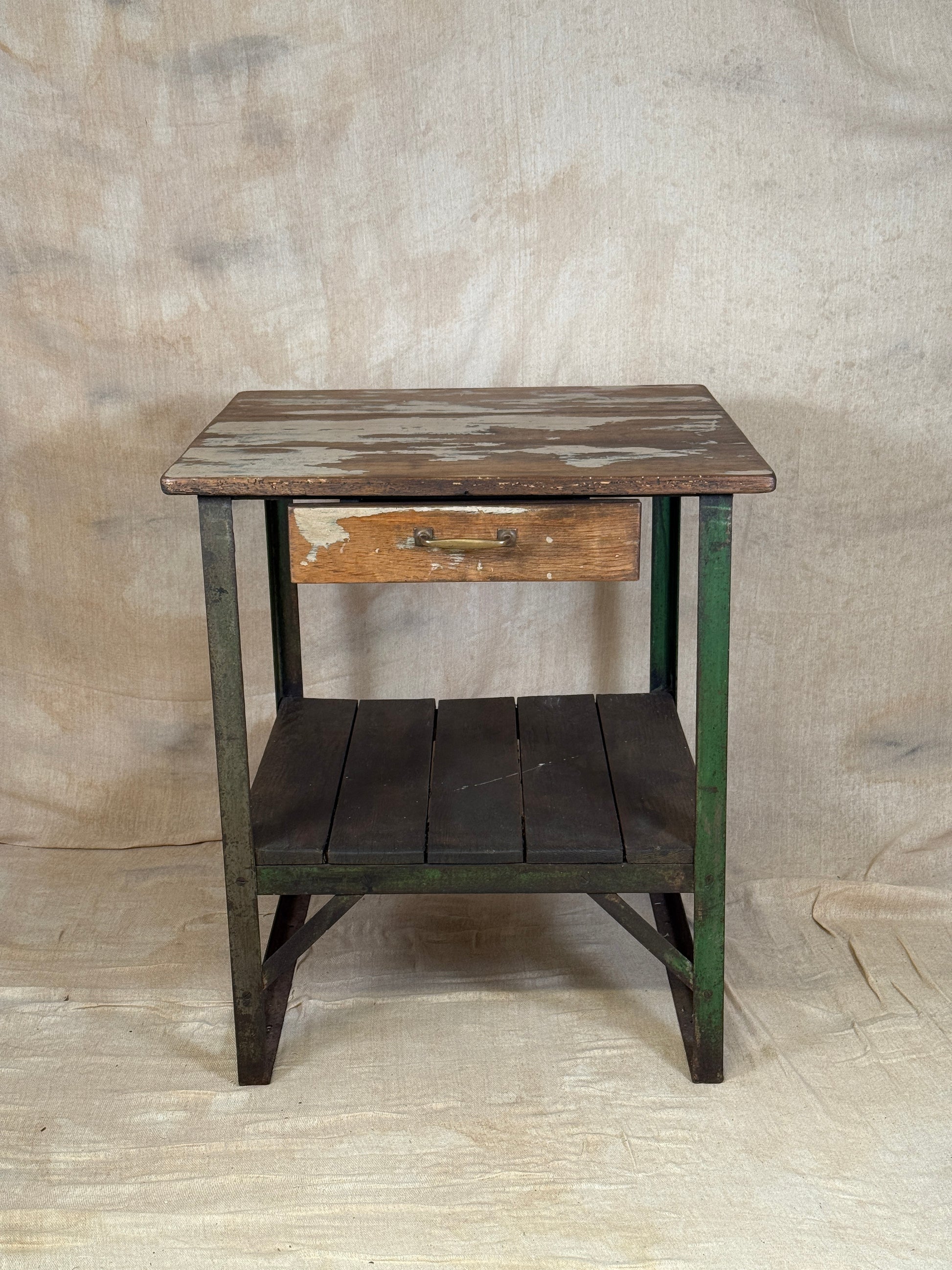 A rustic industrial wooden and metal table.