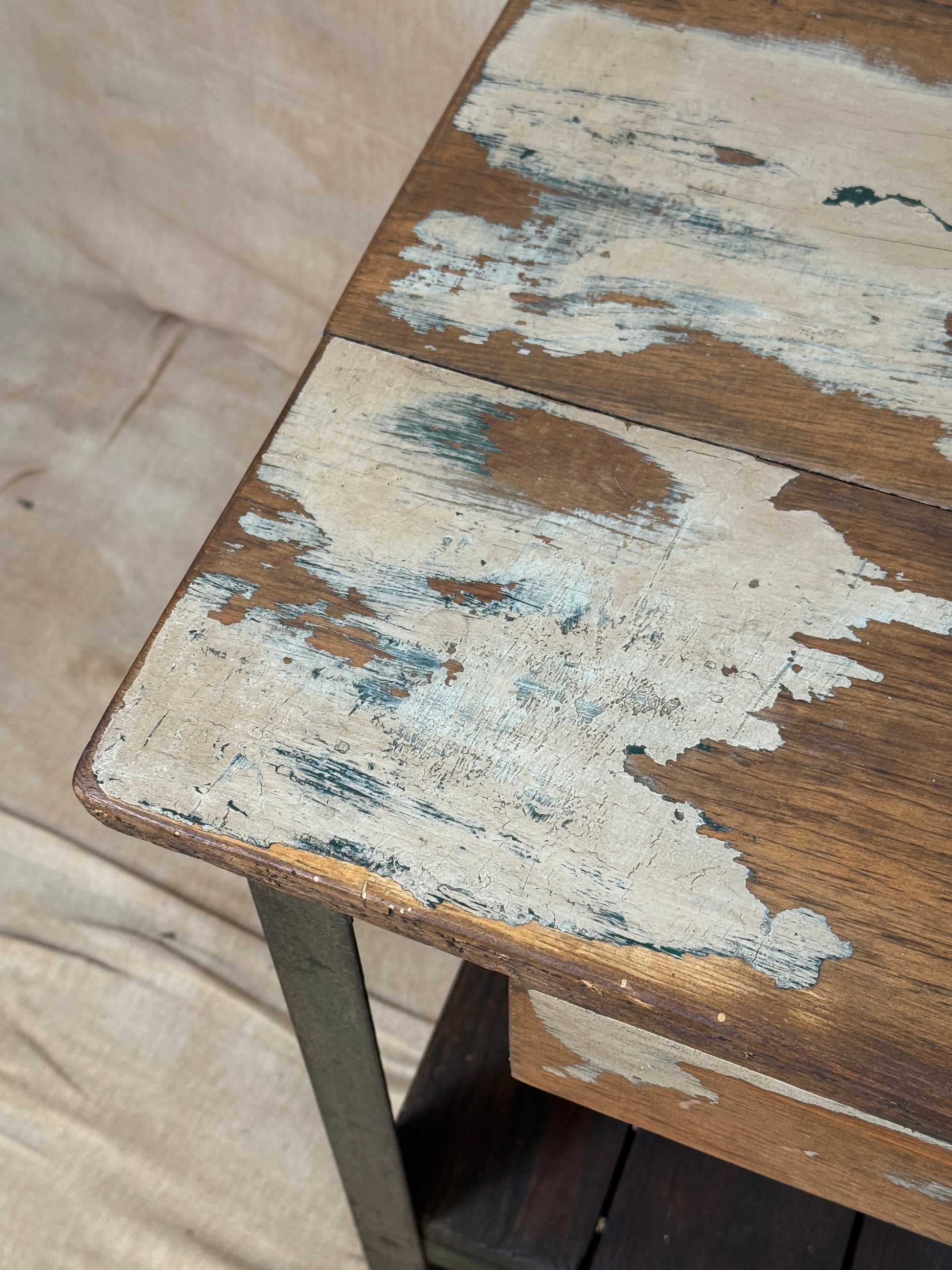 A rustic industrial wooden and metal table.