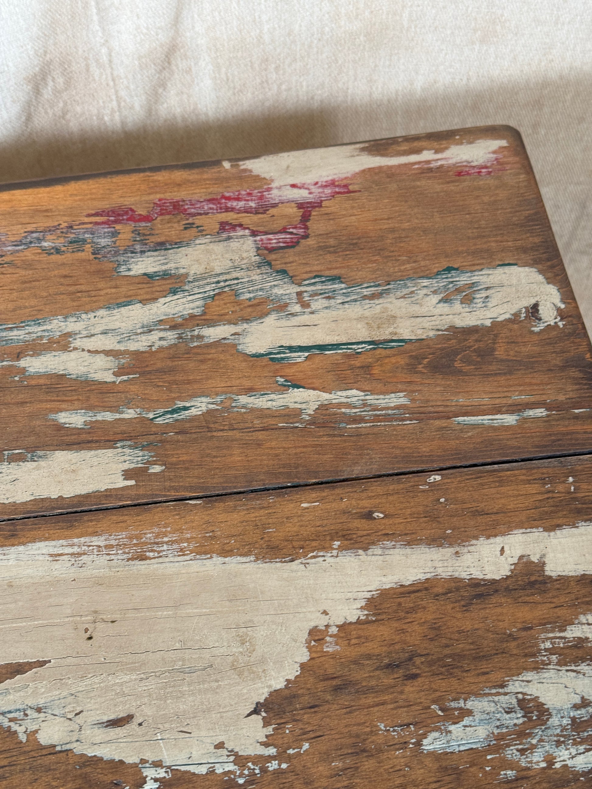 A rustic industrial wooden and metal table.