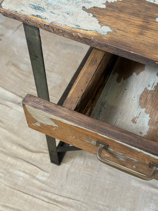 A rustic industrial wooden and metal table.