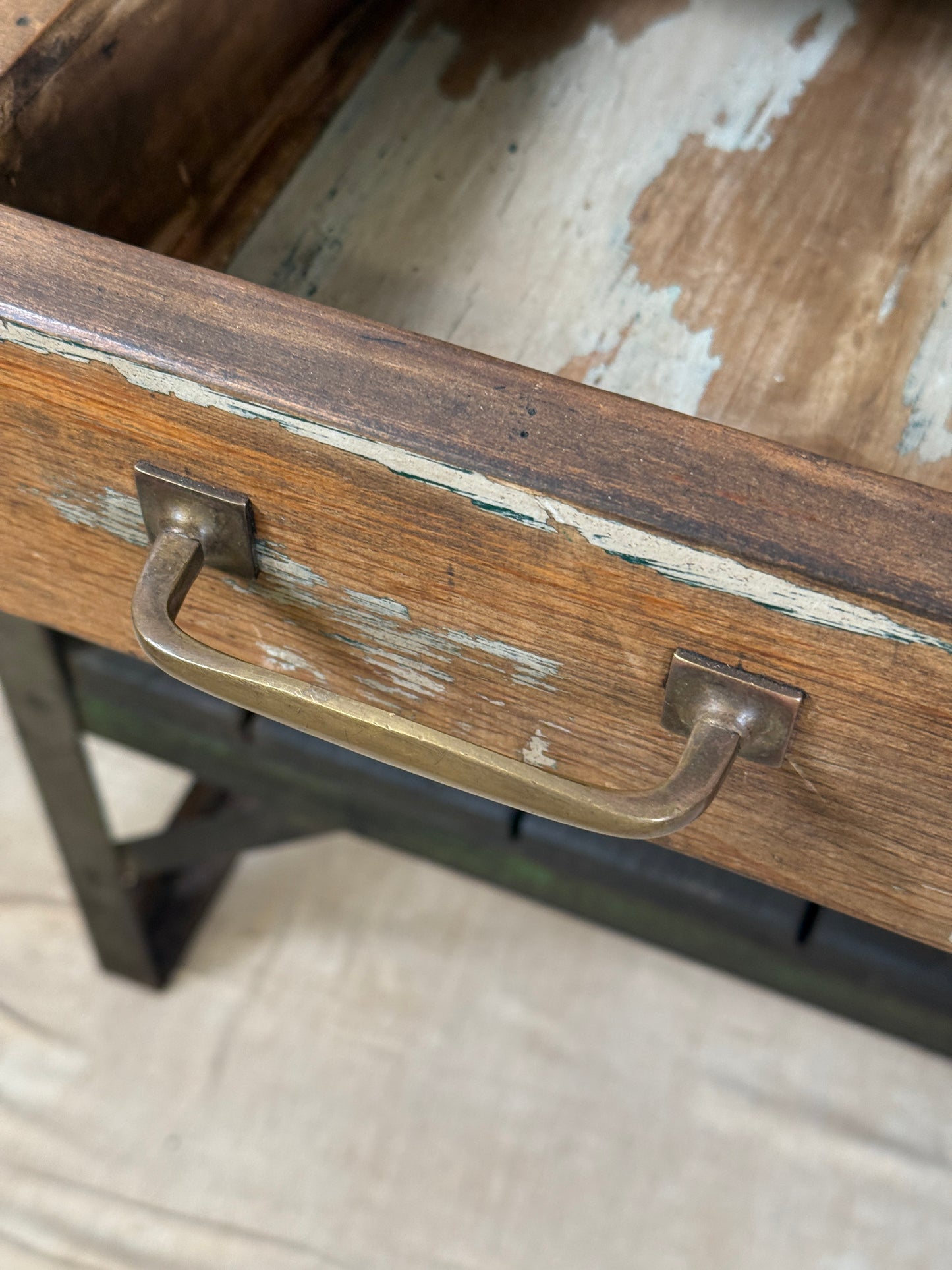 A rustic industrial wooden and metal table.