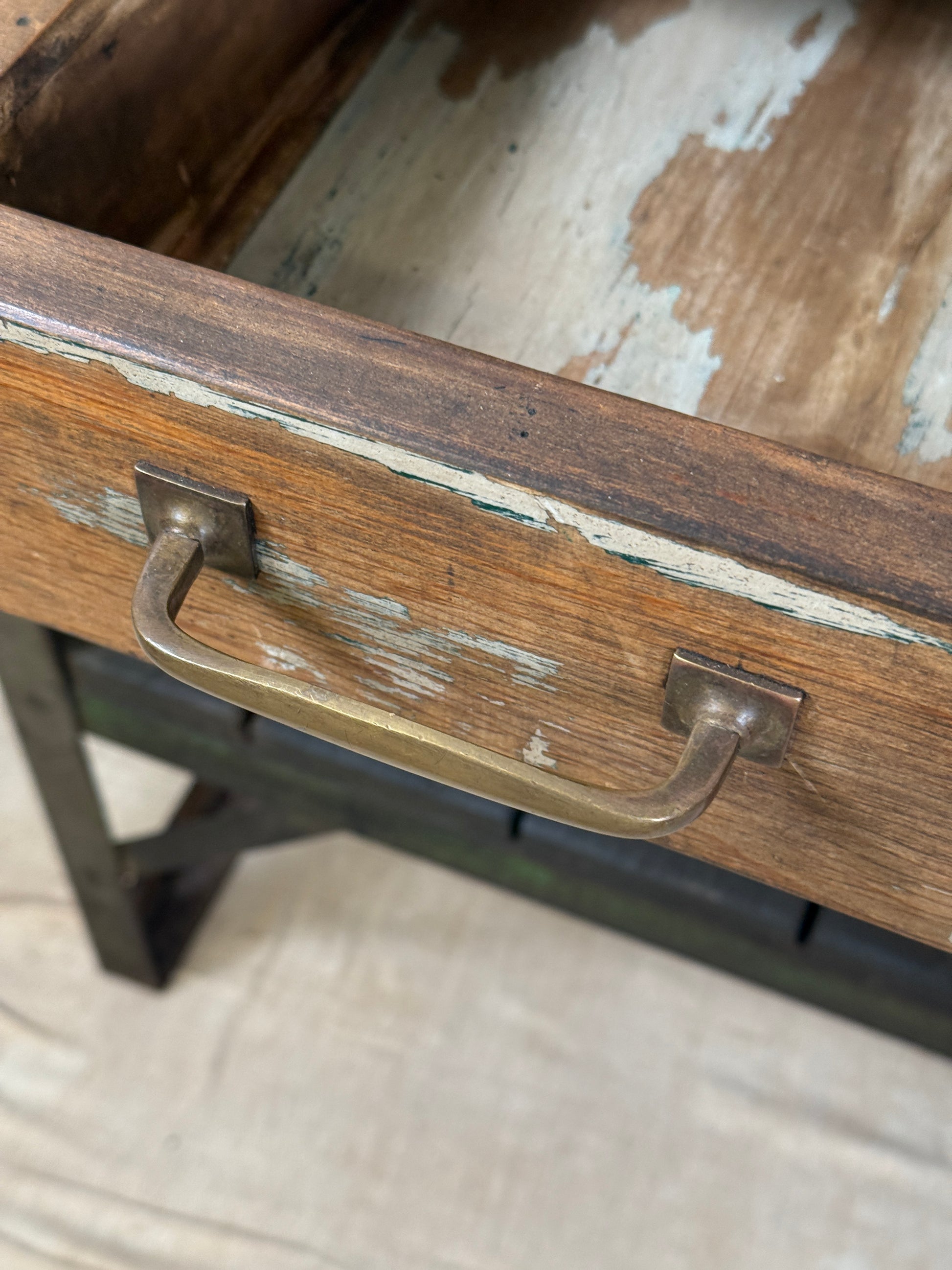 A rustic industrial wooden and metal table.