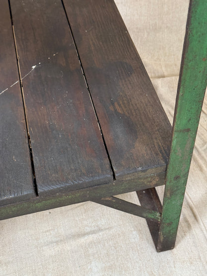 A rustic industrial wooden and metal table.