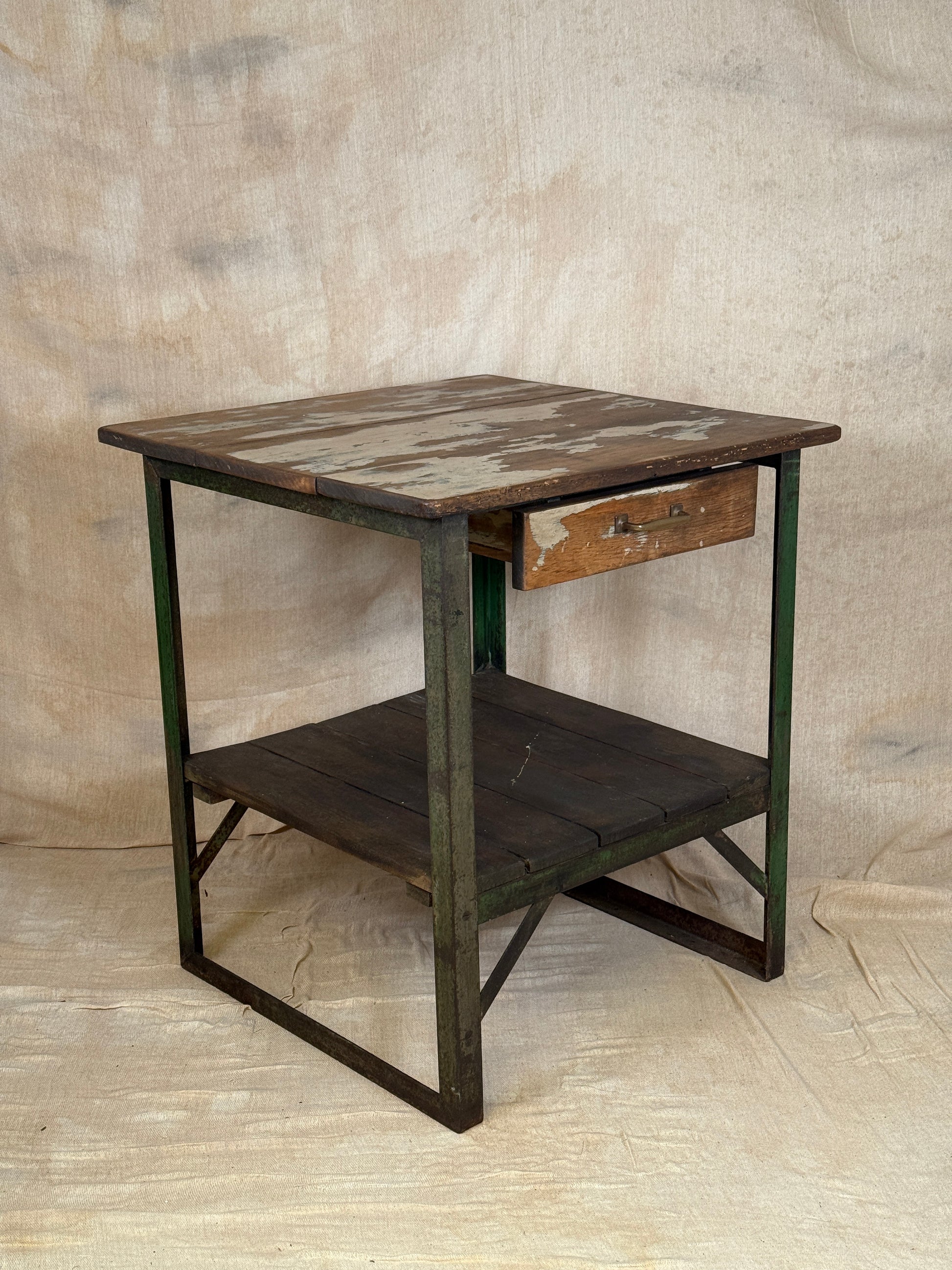 A rustic industrial wooden and metal table.