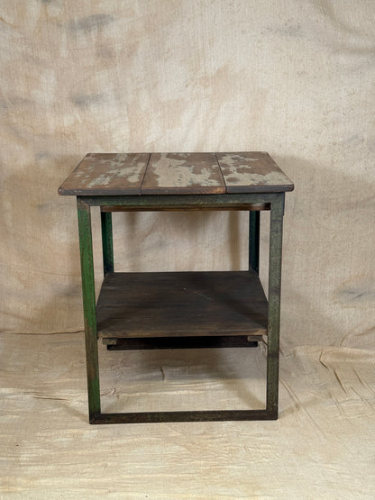 A rustic industrial wooden and metal table.