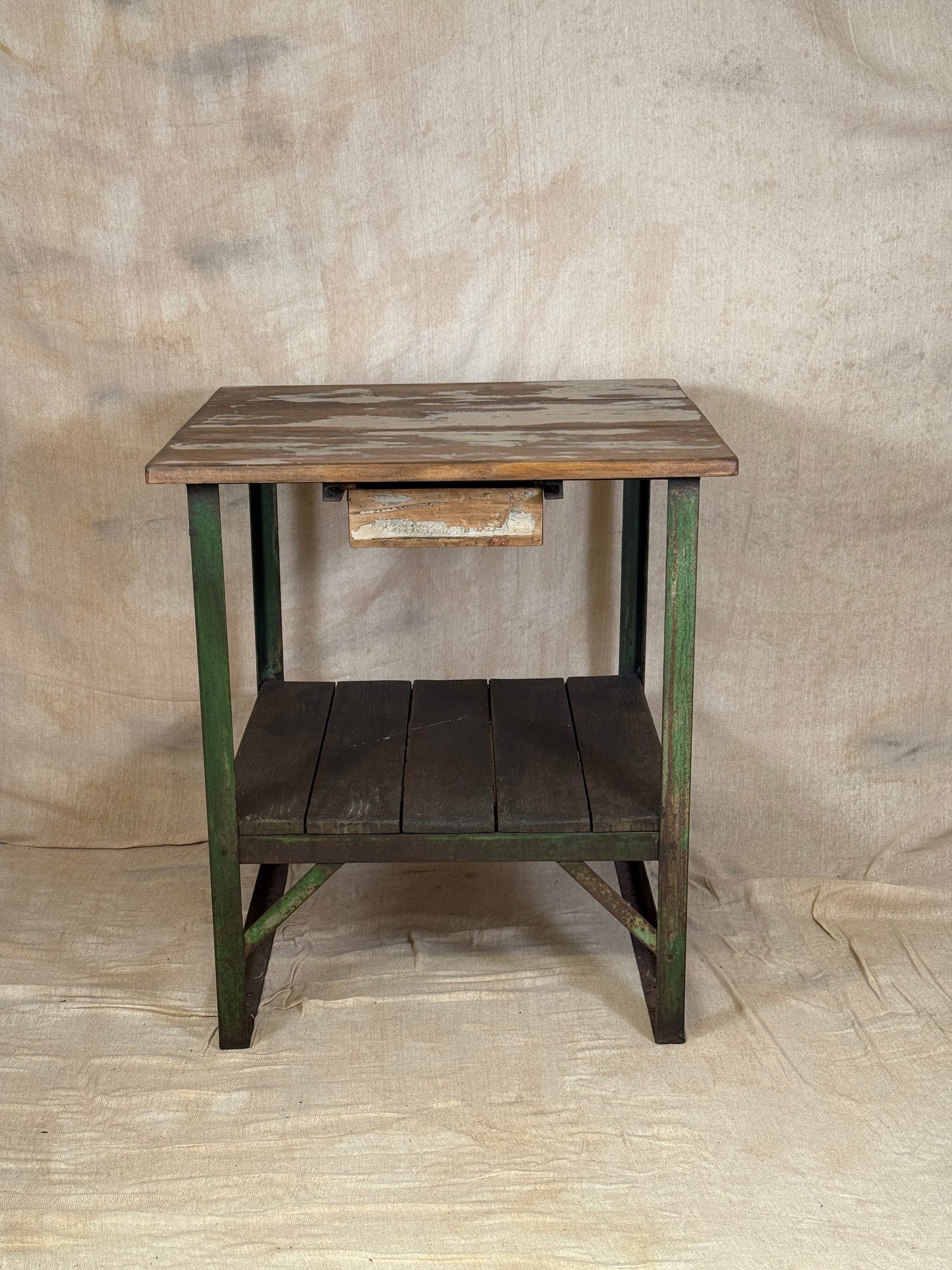 A rustic industrial wooden and metal table.