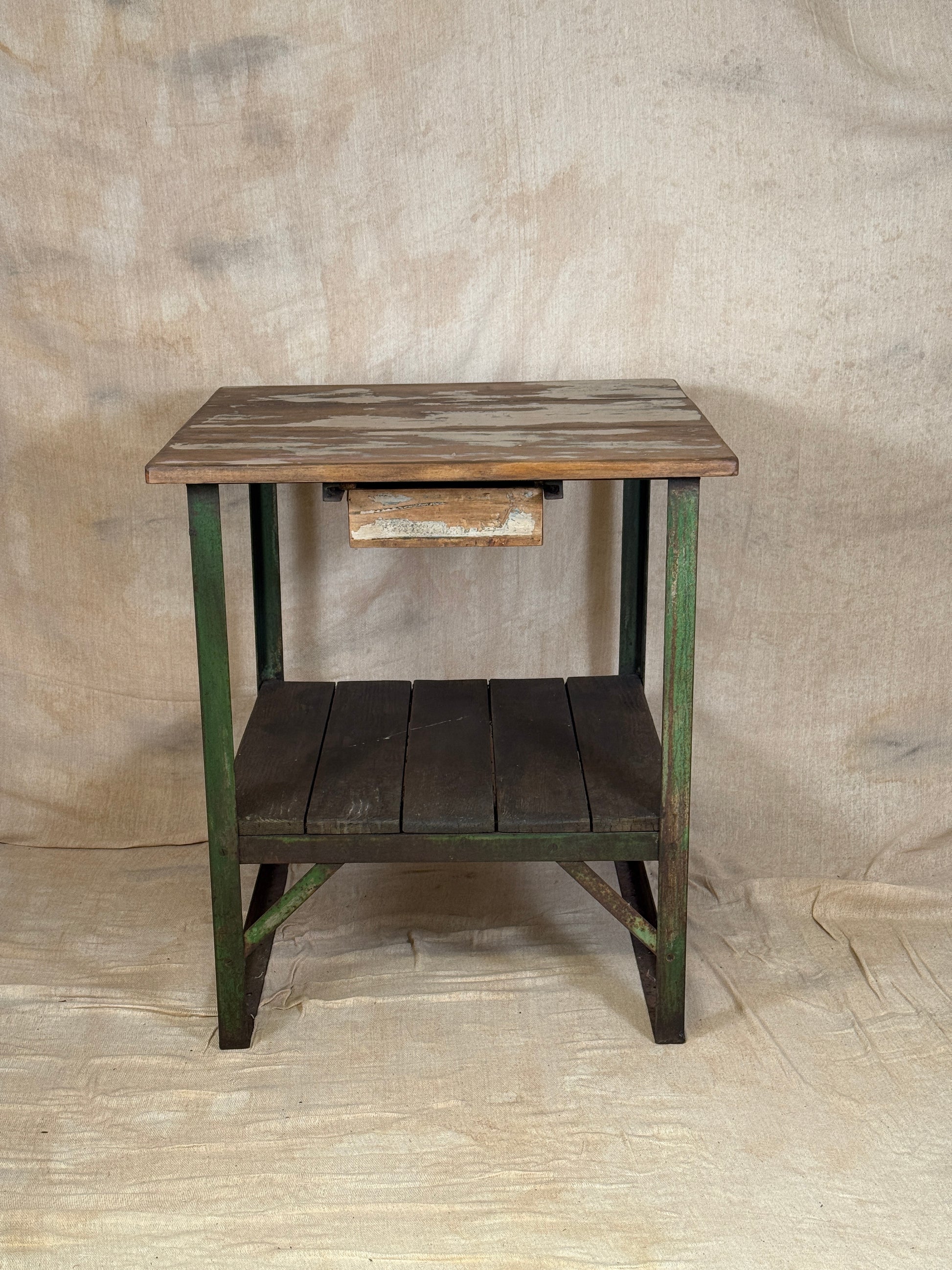 A rustic industrial wooden and metal table.
