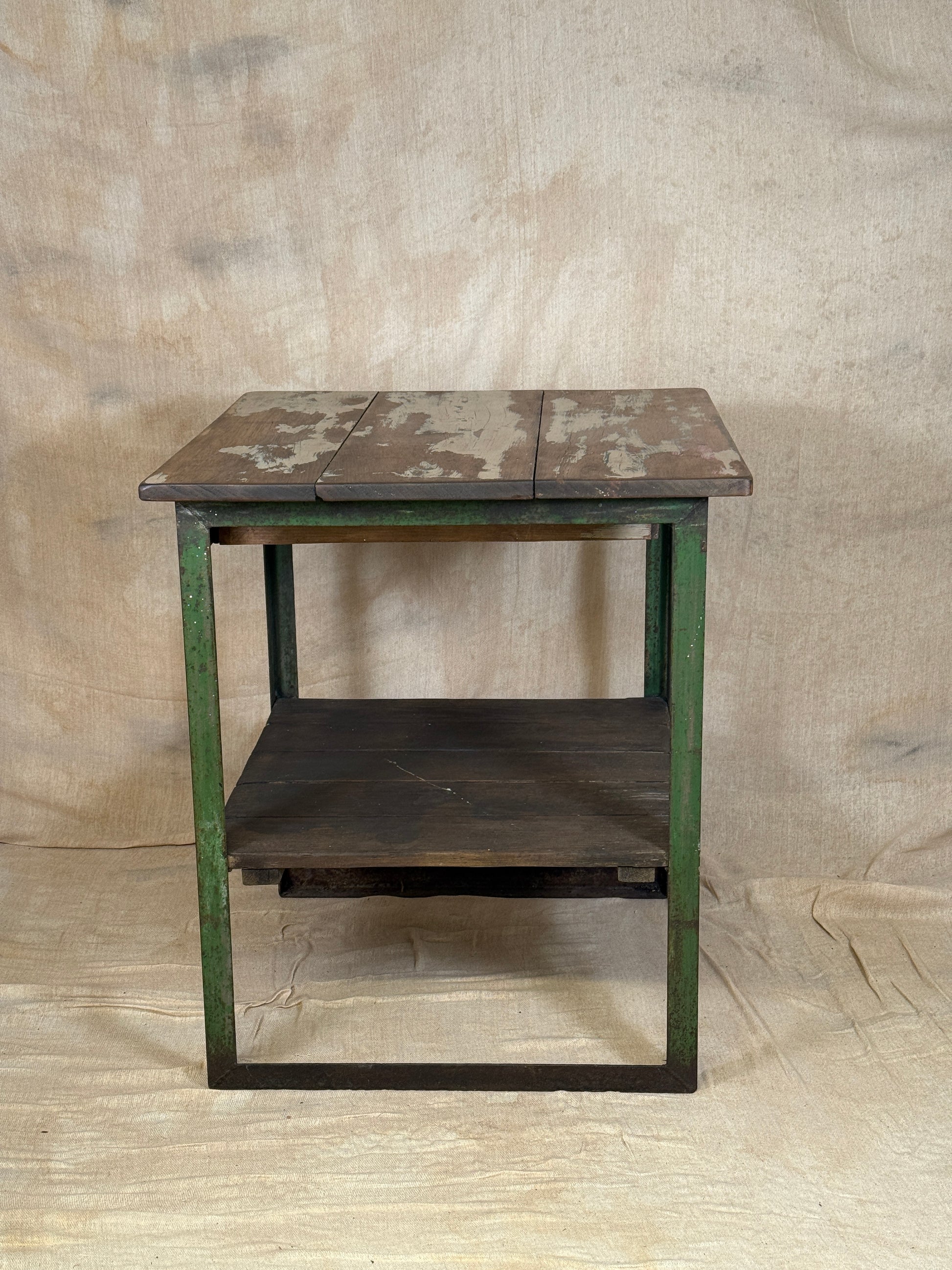 A rustic industrial wooden and metal table.