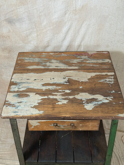 A rustic industrial wooden and metal table.