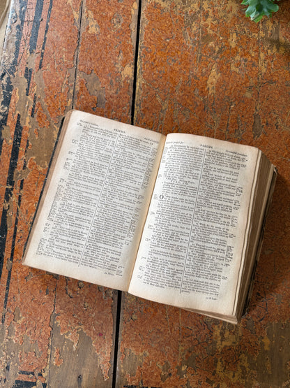 Open book on a textured wooden surface