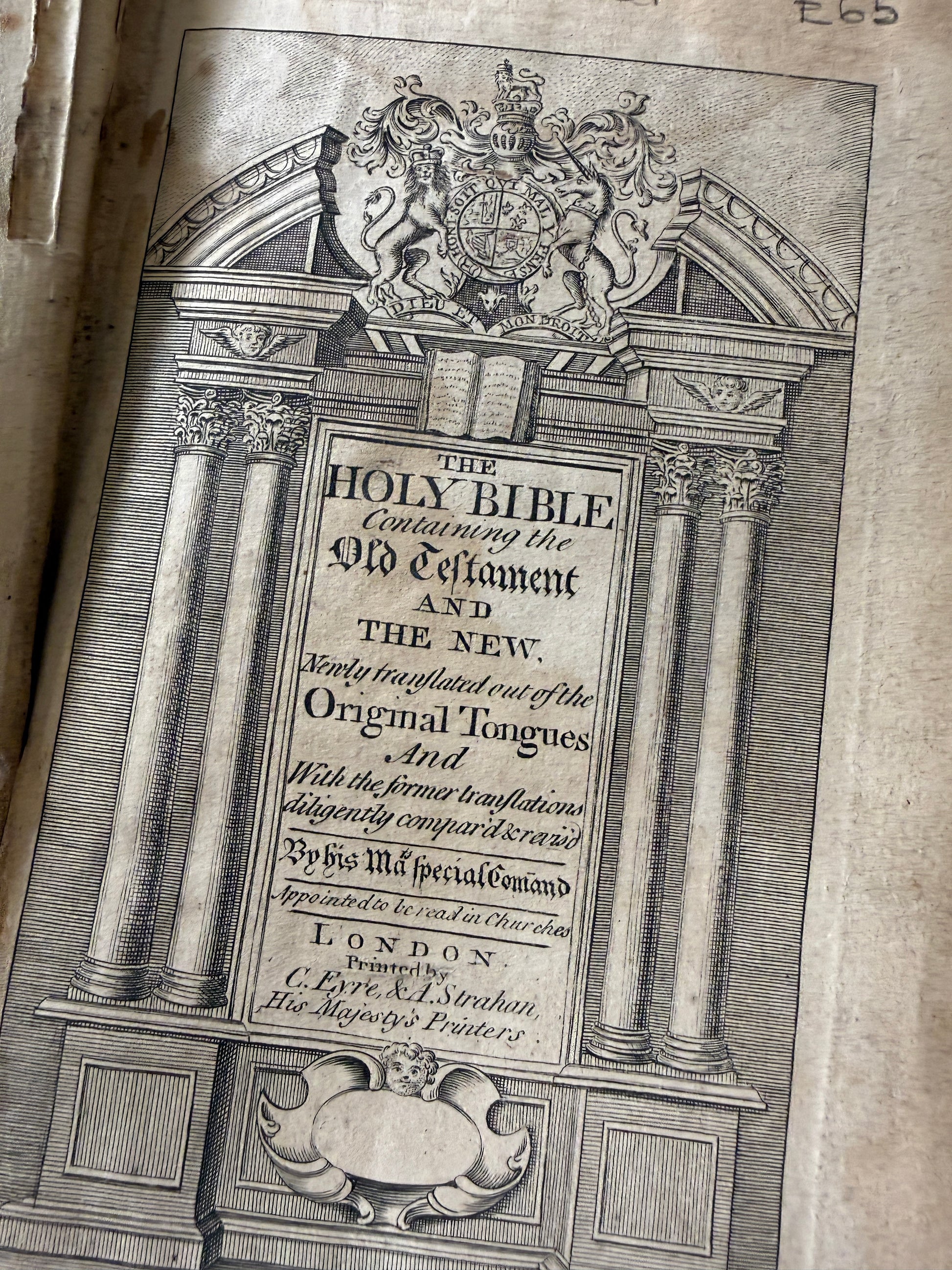 Decorative title page of a book with intricate designs and text.