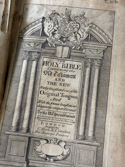 Decorative title page of a book with intricate designs and text.