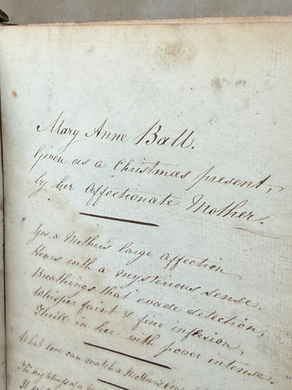 Close-up of an old document with handwritten text on a plain background