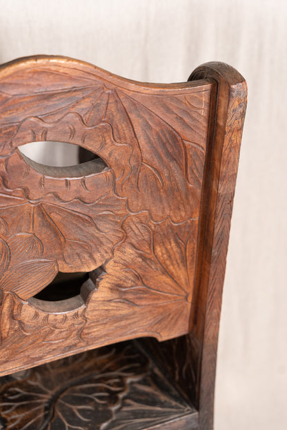 Liberty & Co. Japanese carved hardwood bench, circa 1900–1910, featuring pierced floral panels and intricate decoration from the Arts and Crafts period.
