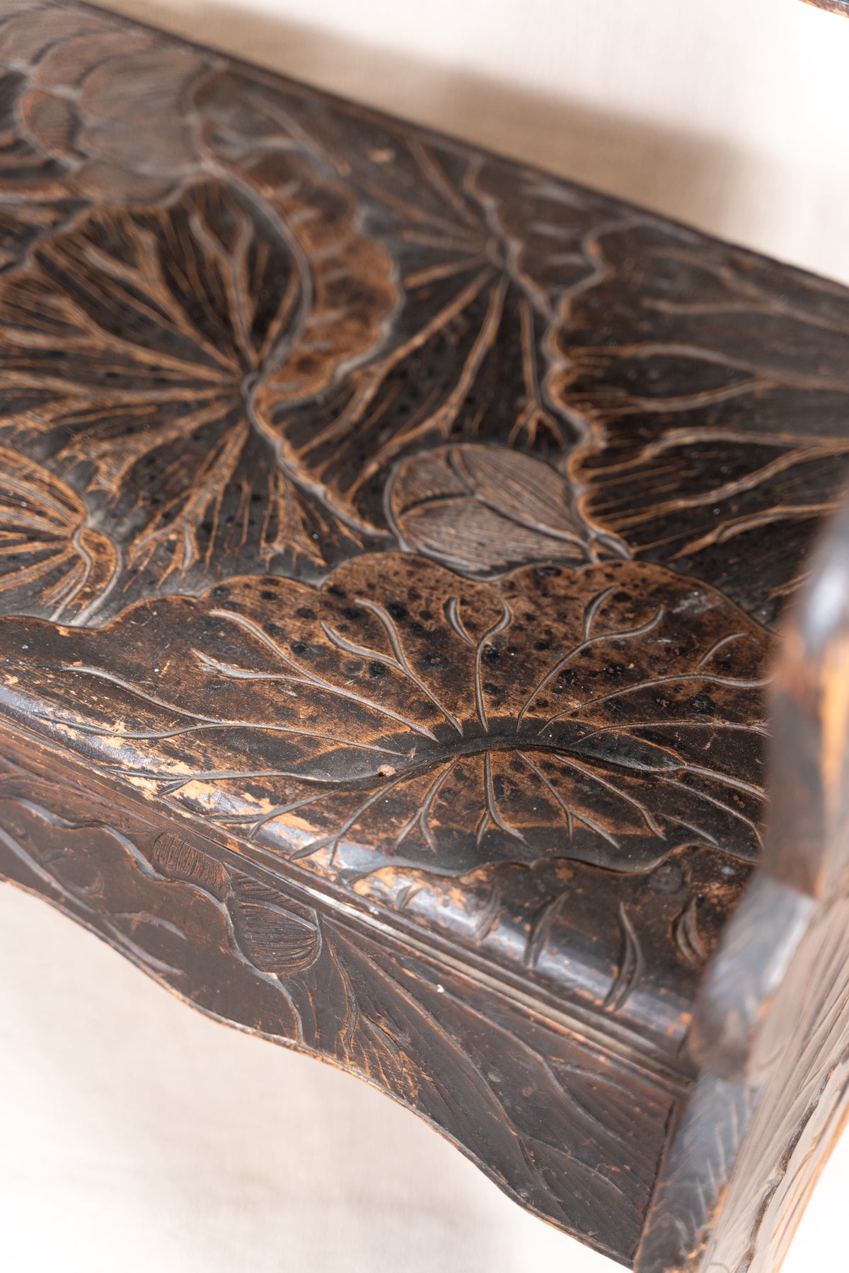 Liberty & Co. Japanese carved hardwood bench, circa 1900–1910, featuring pierced floral panels and intricate decoration from the Arts and Crafts period.