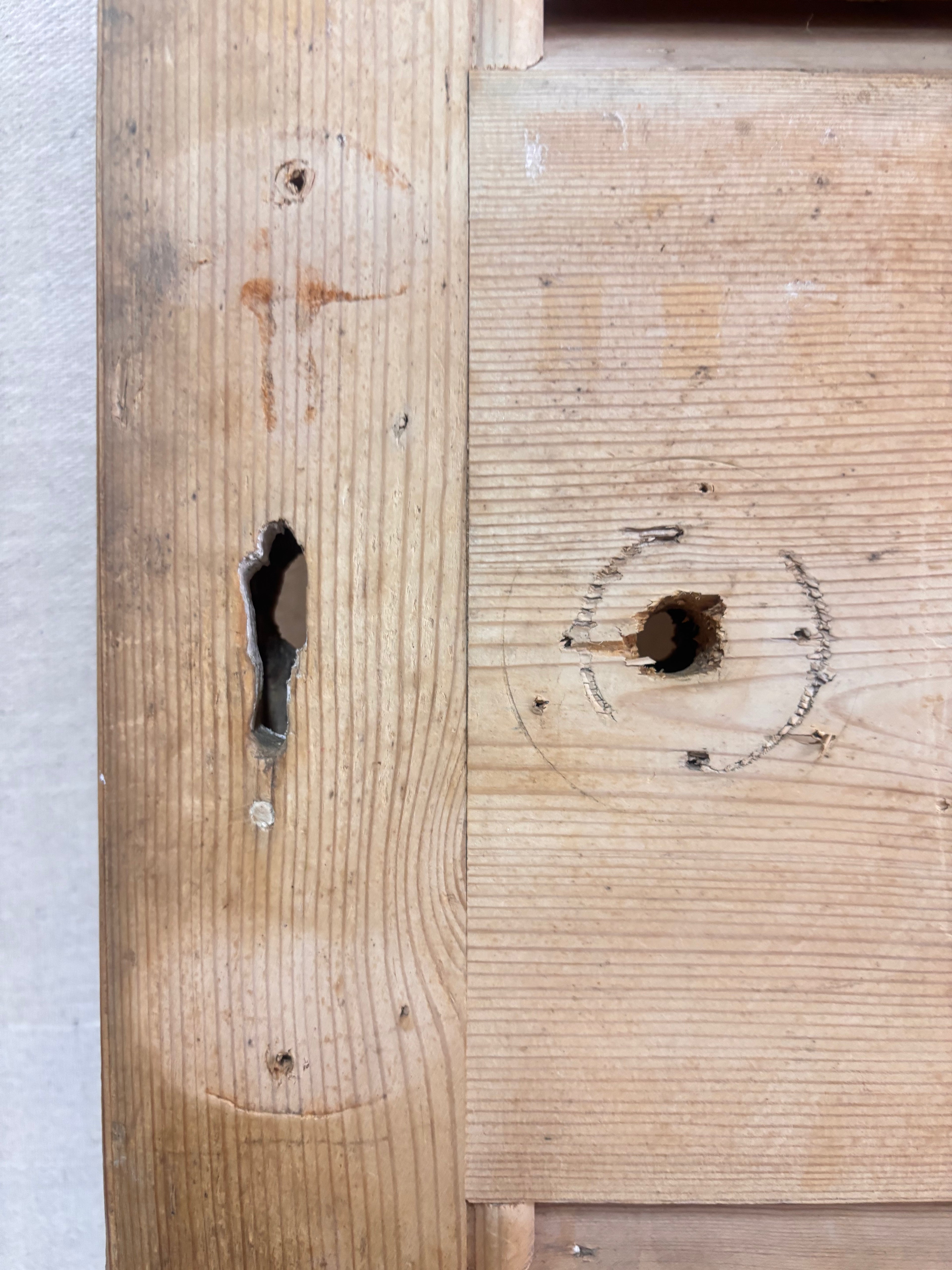 a Wooden Louvered Door against a cream backdrop