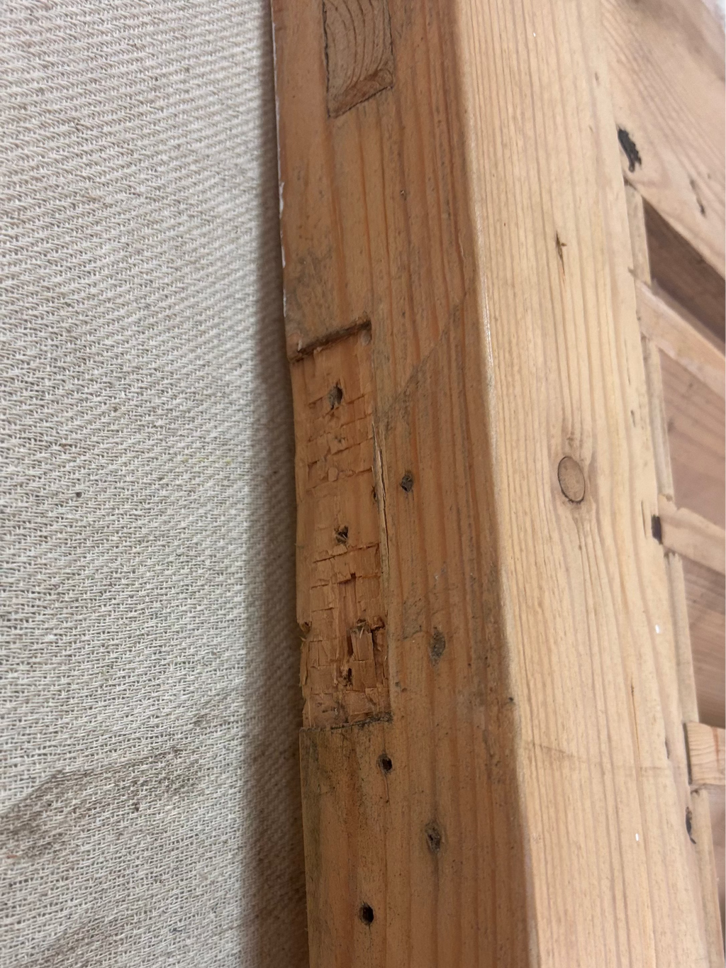 a Wooden Louvered Door against a cream backdrop