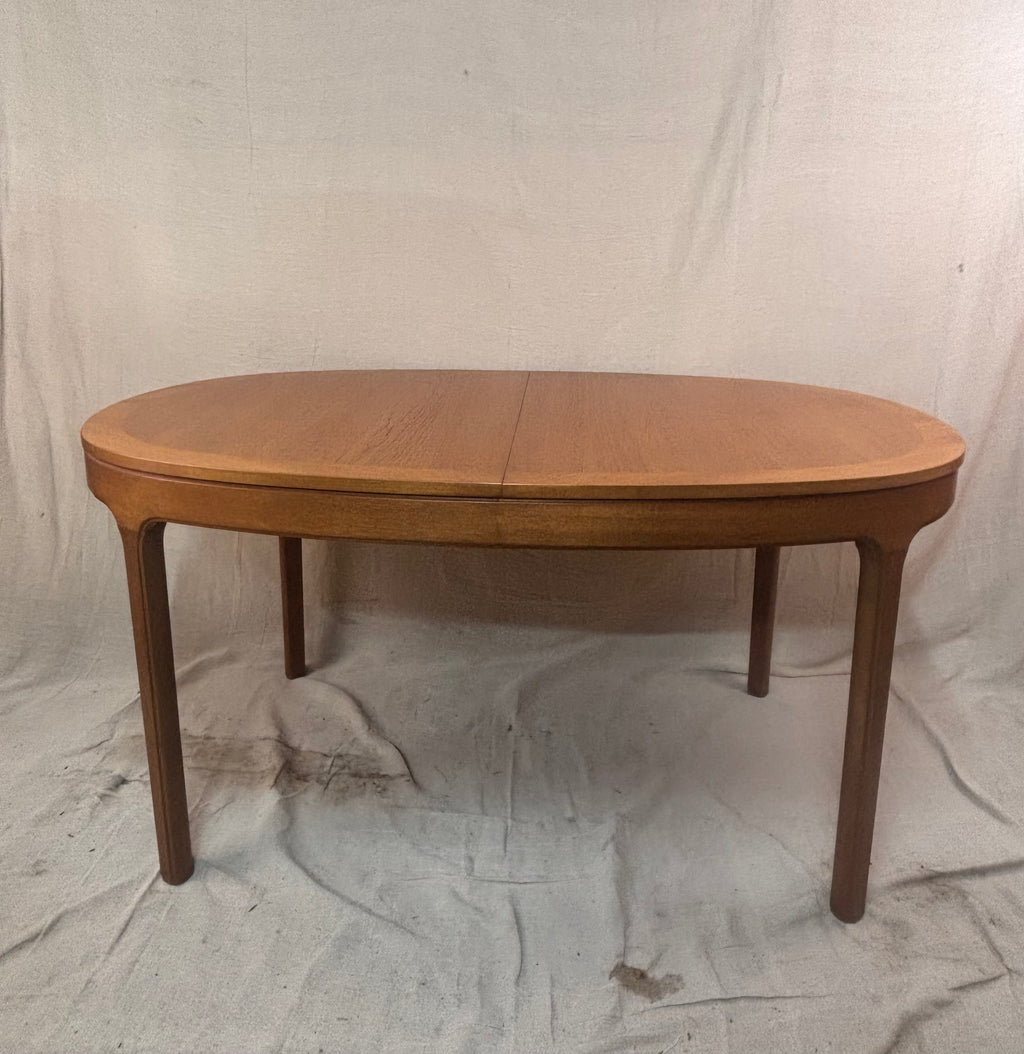 An oval wooden dining table
