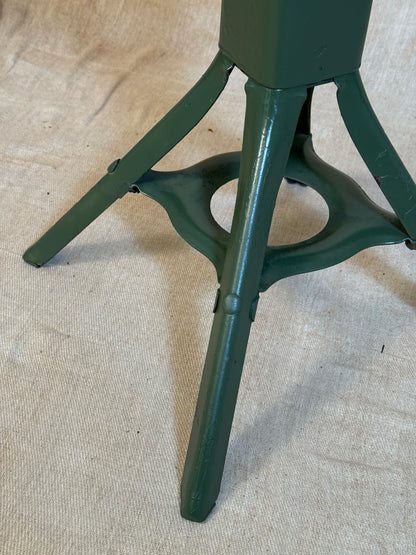 Vintage industrial machinist chair with green steel frame, wooden seat. 