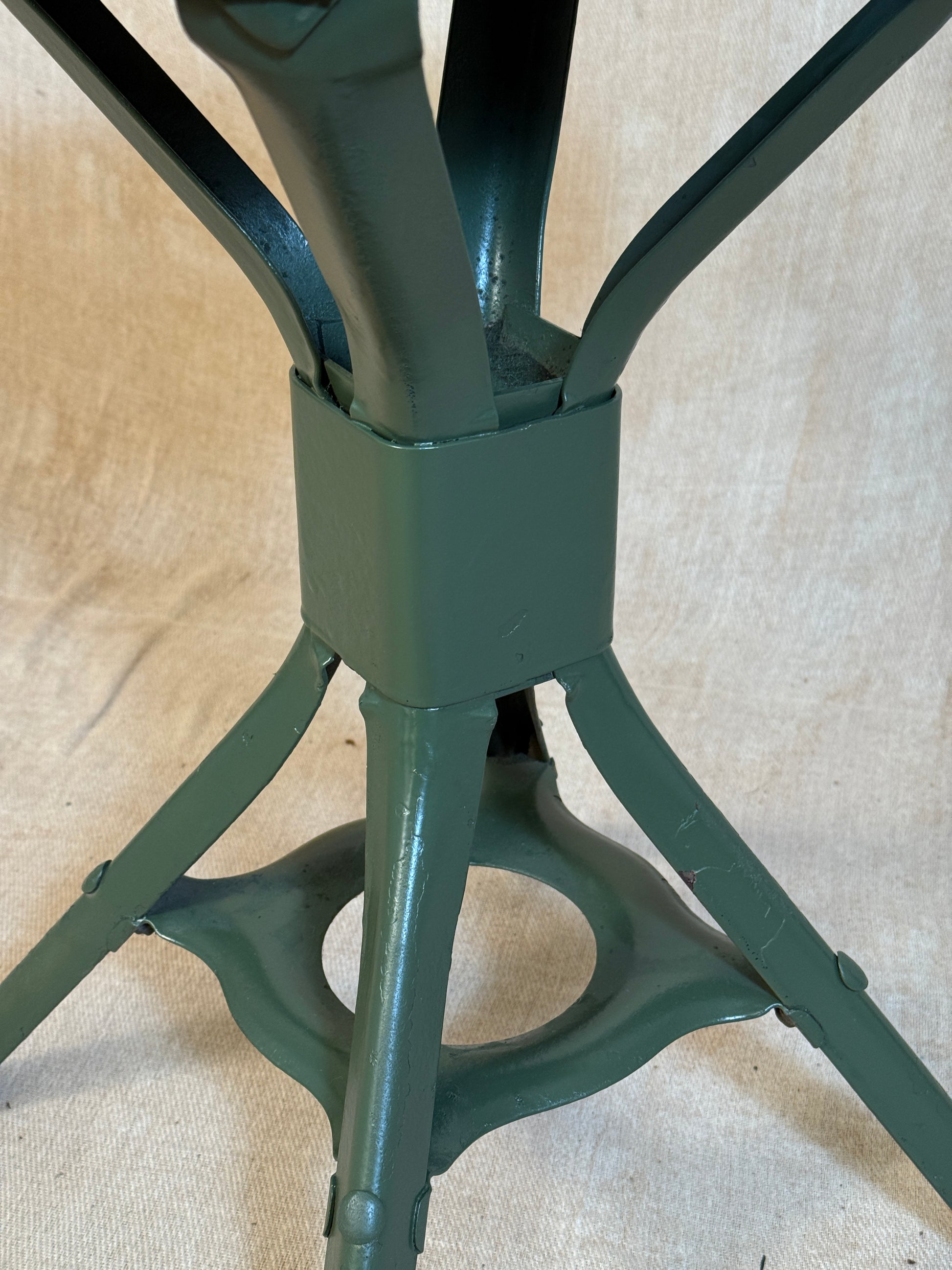 Vintage industrial machinist chair with green steel frame, wooden seat. 