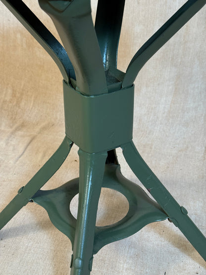 Vintage industrial machinist chair with green steel frame, wooden seat. 