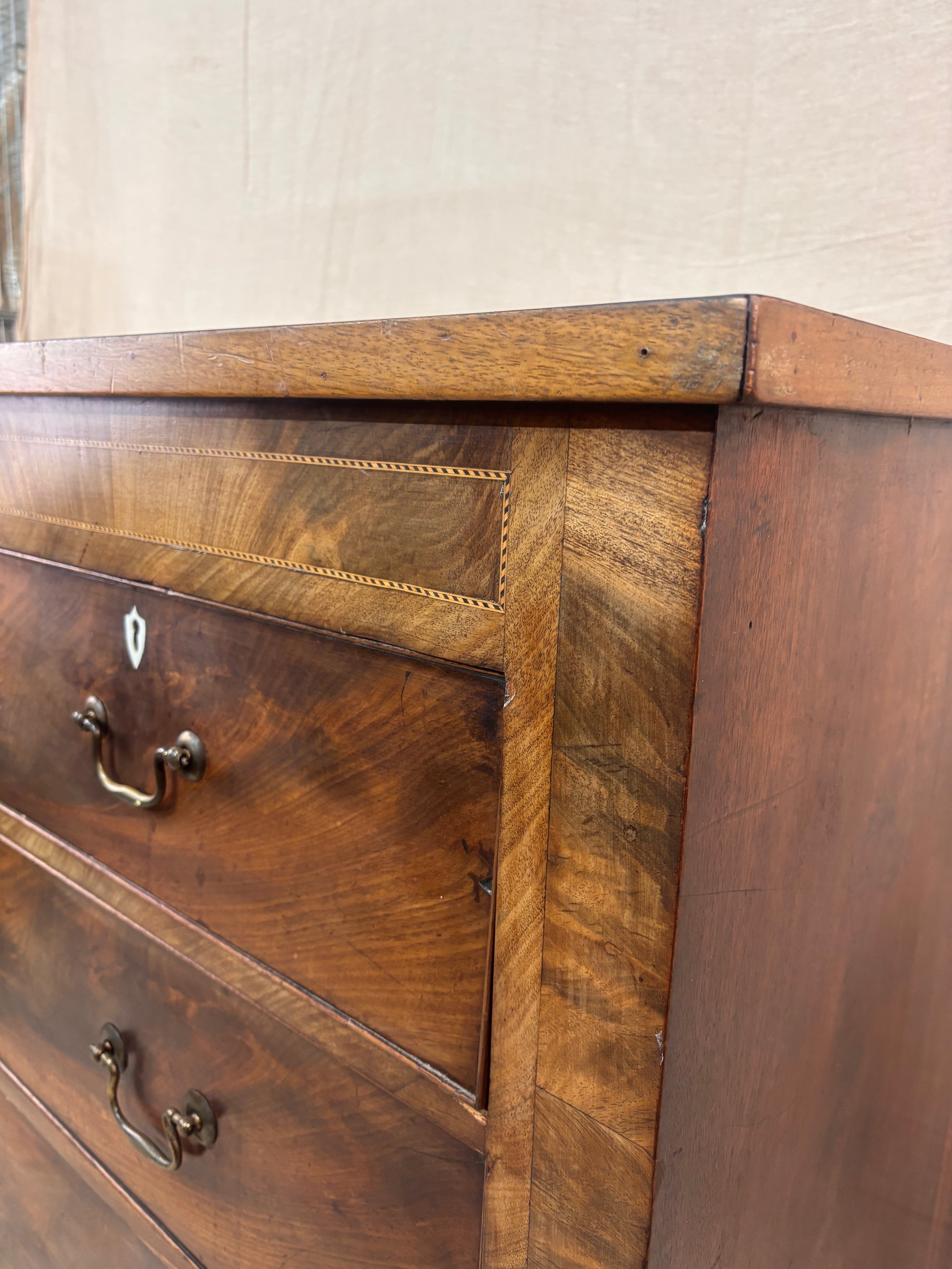 Close-up of a wooden dresser with visible grain and texture.