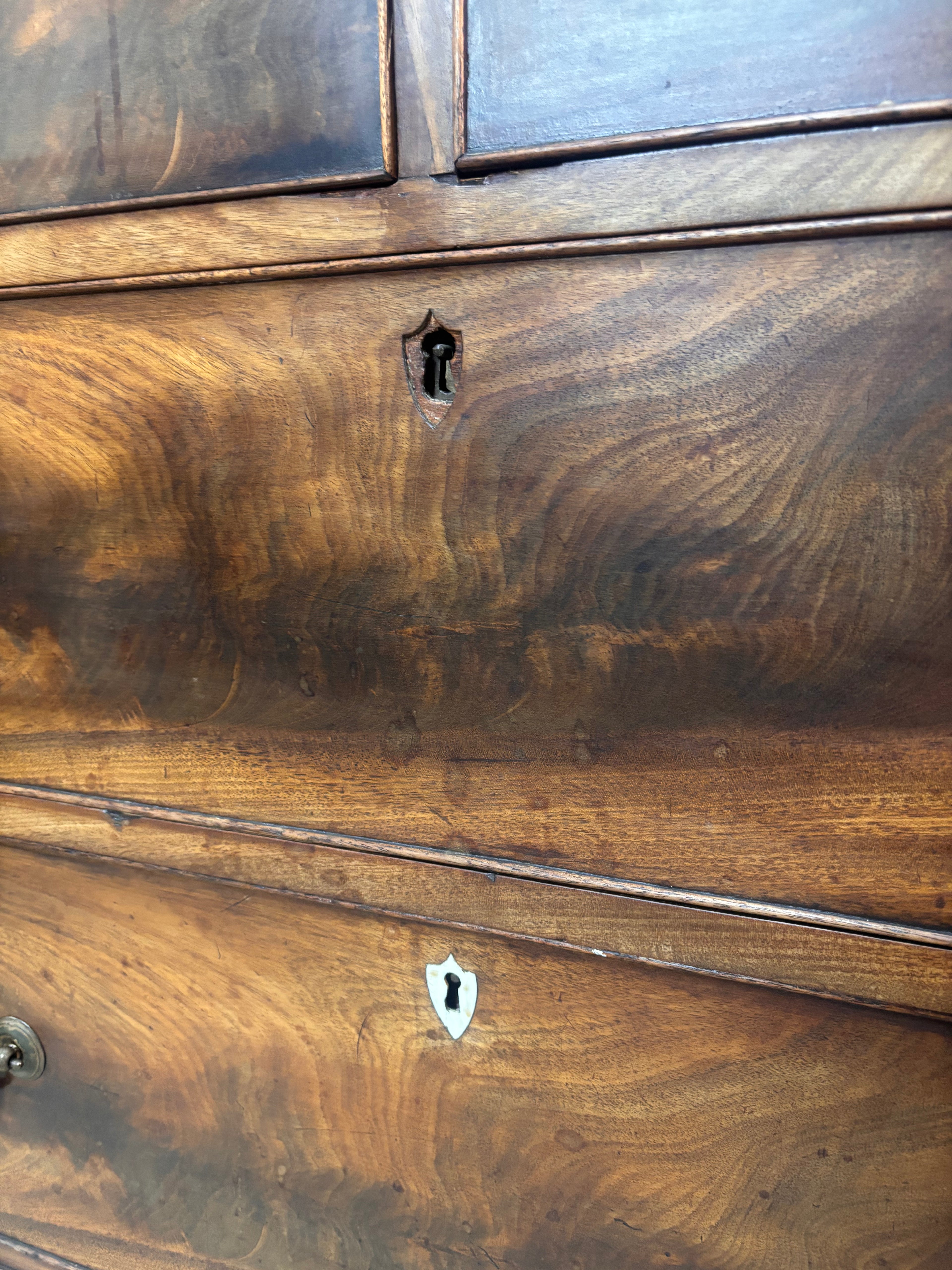 Close-up of a wooden dresser with visible grain and texture