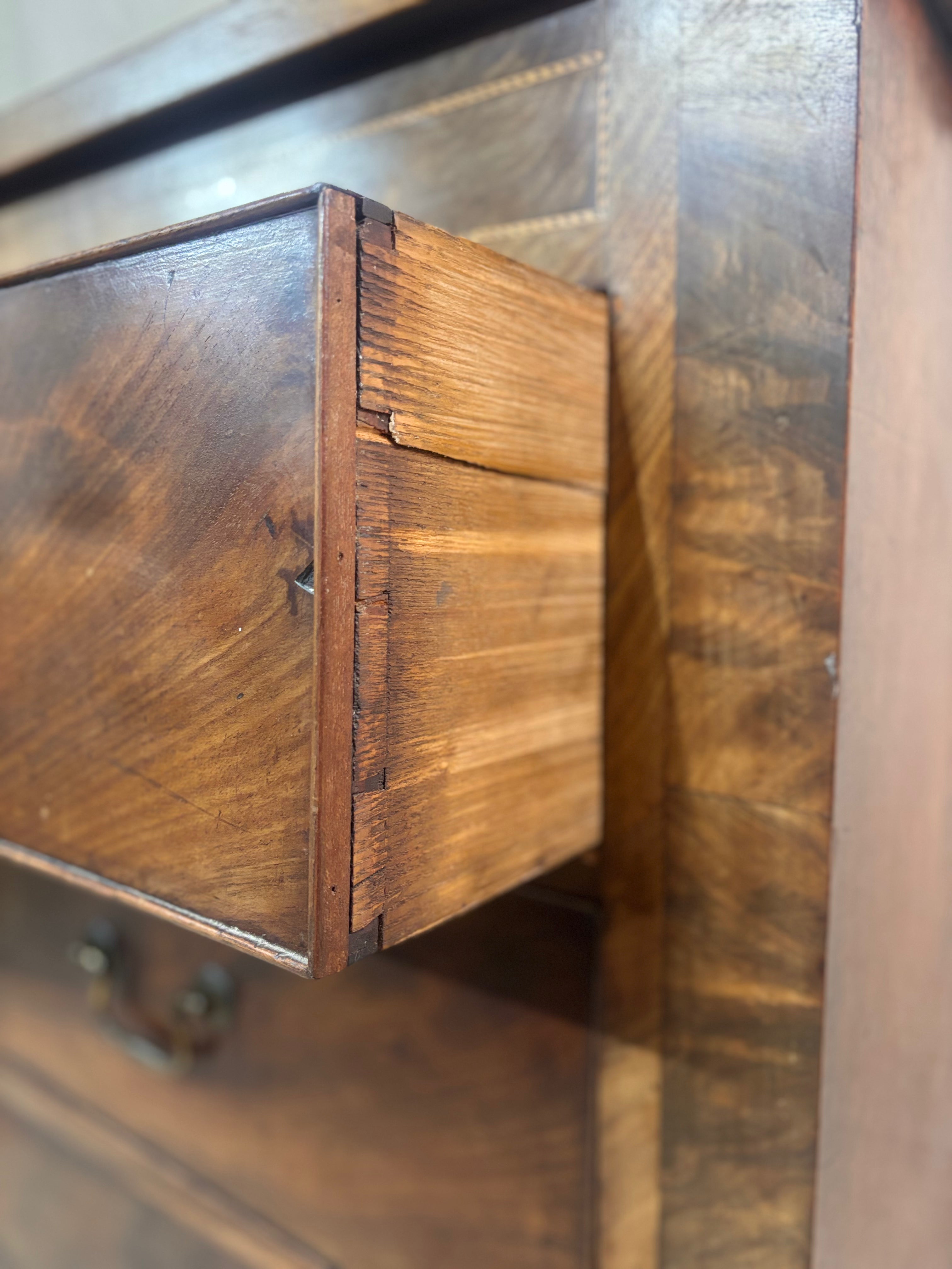 Close-up of a wooden drawer with a rustic finish