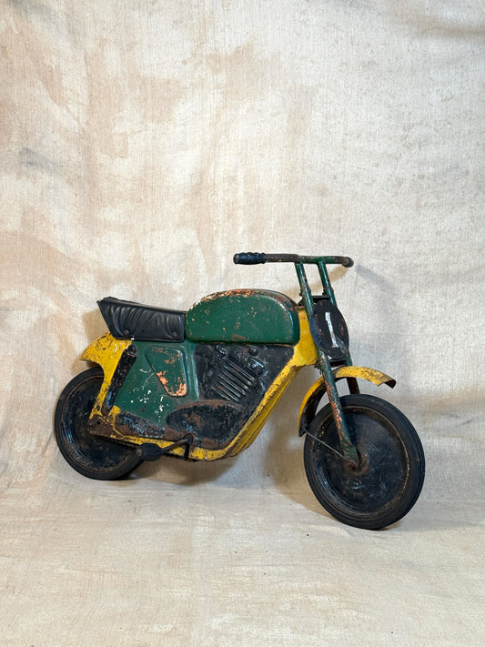 Mobo pressed steel pedal Motorcycle with yellow and green distressed paint. 