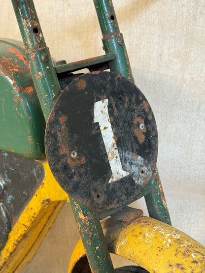 Mobo pressed steel pedal Motorcycle with yellow and green distressed paint. 