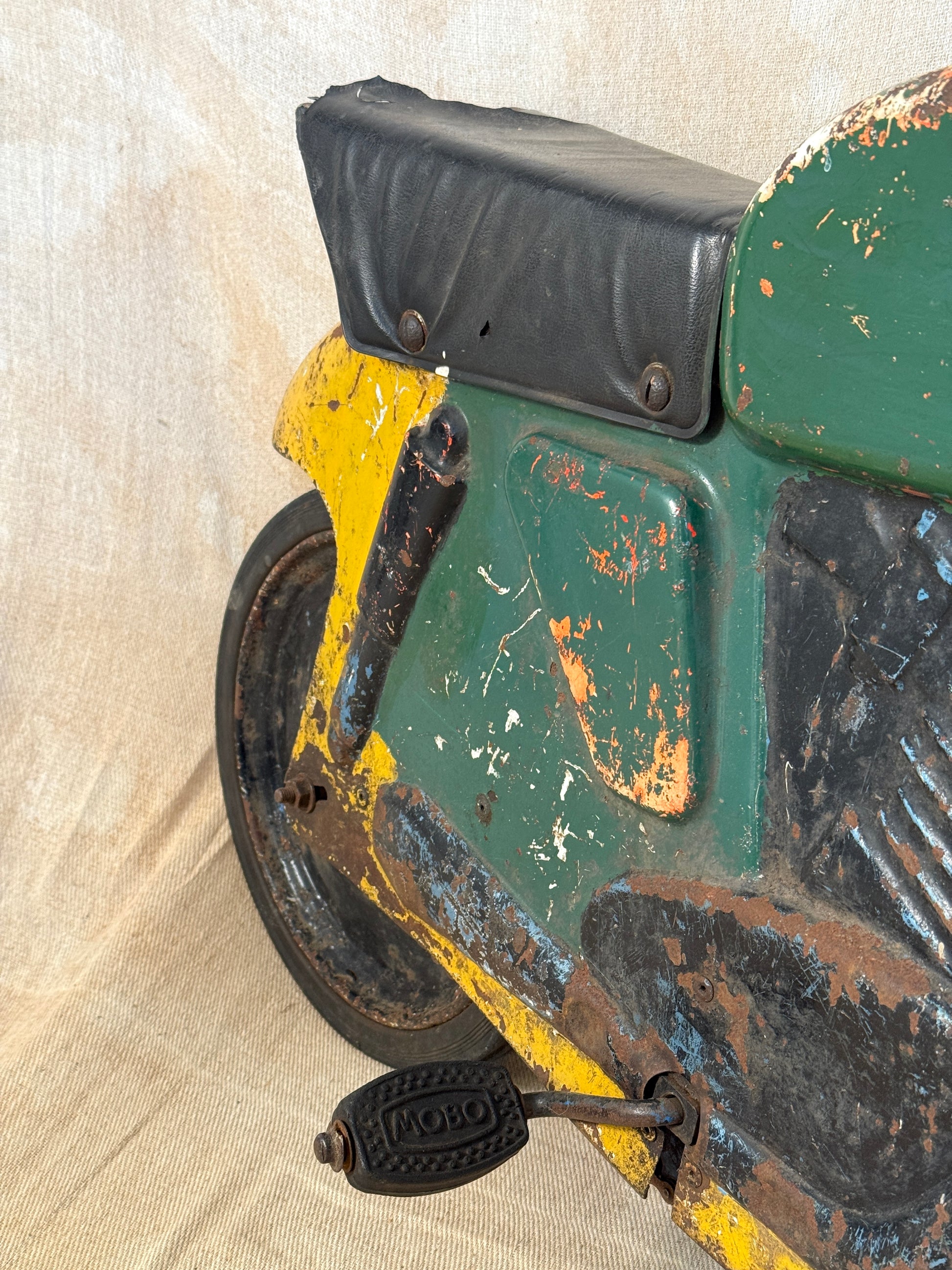 Mobo pressed steel pedal Motorcycle with yellow and green distressed paint. 