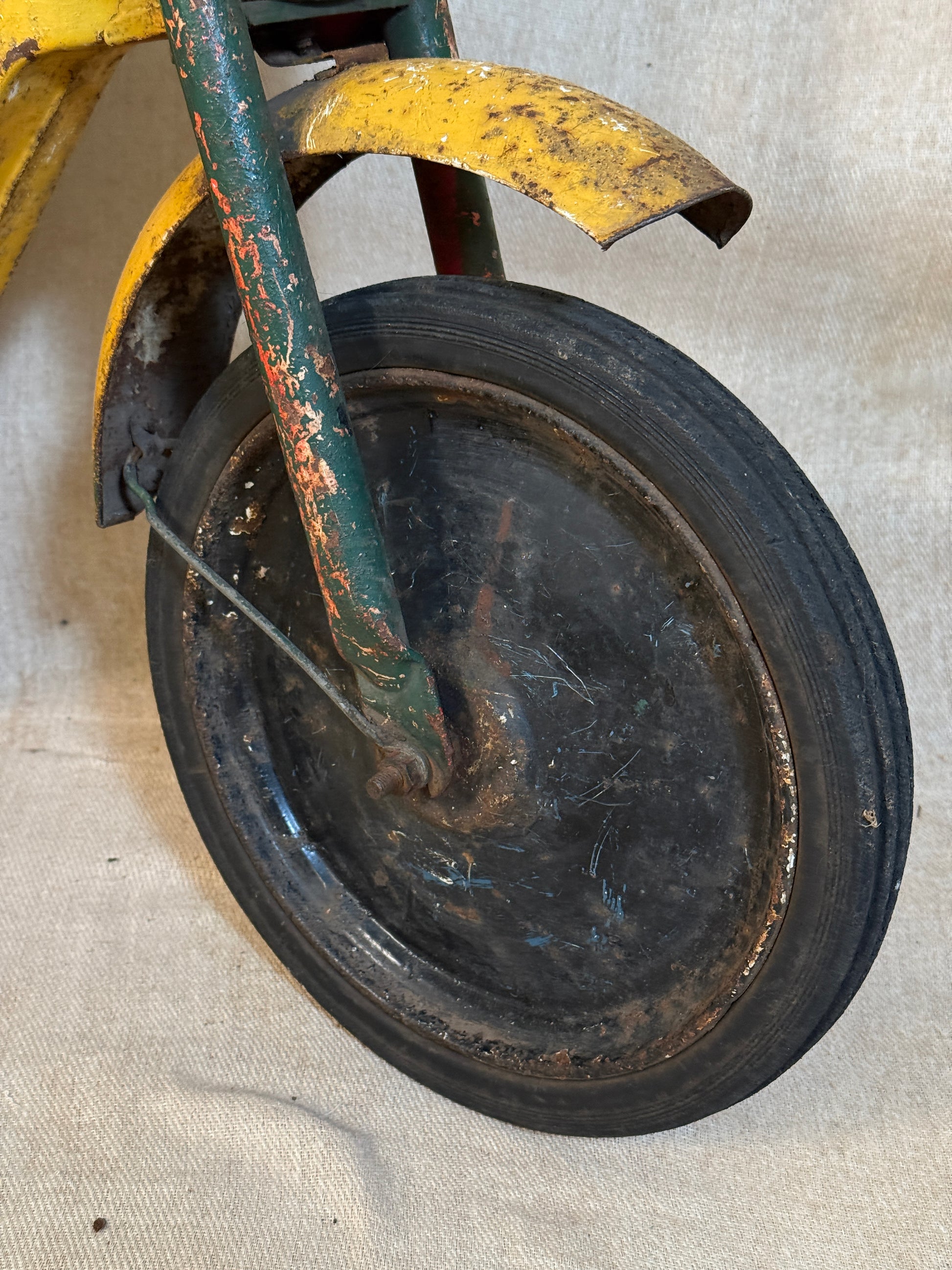 Mobo pressed steel pedal Motorcycle with yellow and green distressed paint. 