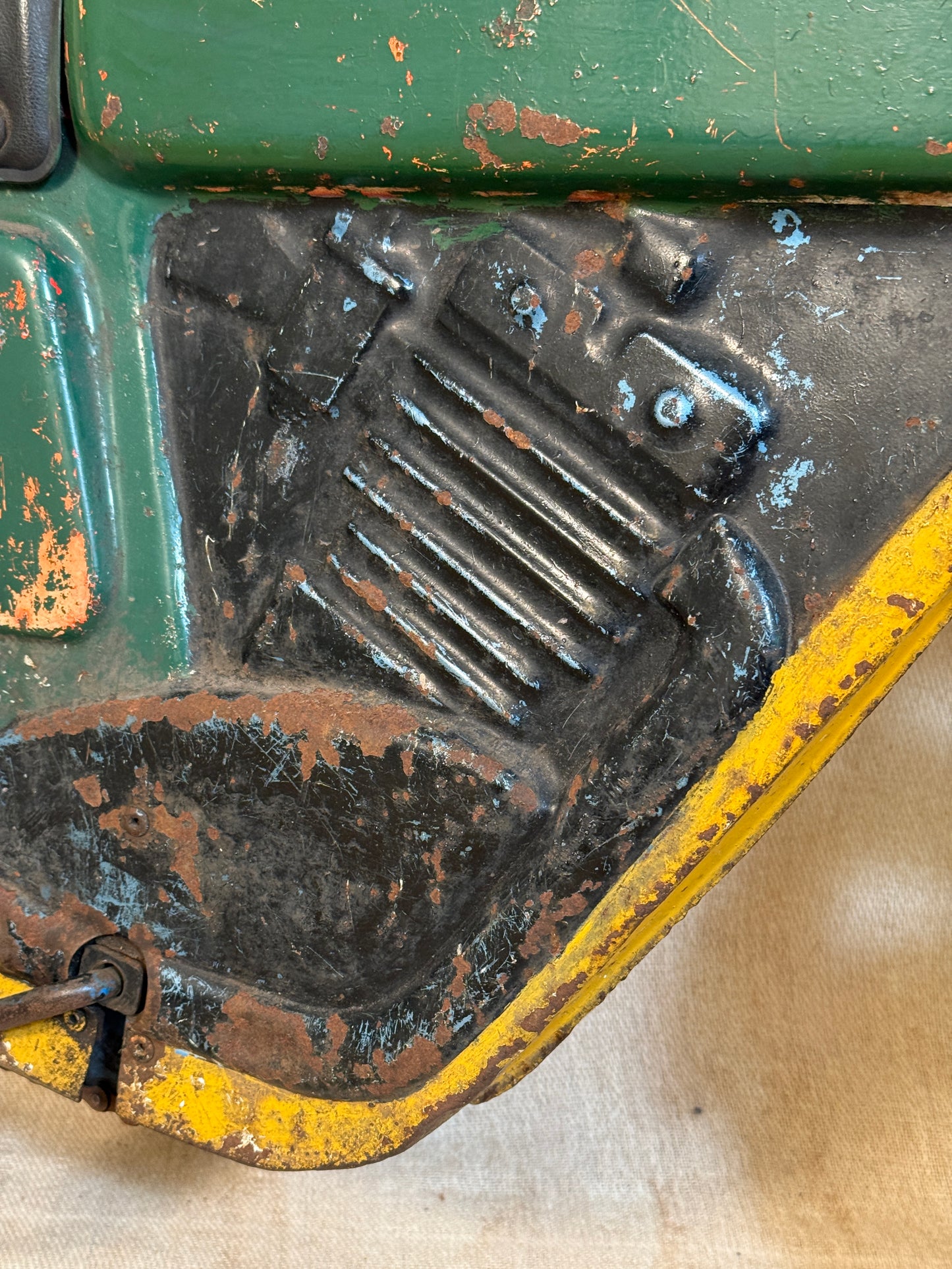 Mobo pressed steel pedal Motorcycle with yellow and green distressed paint. 
