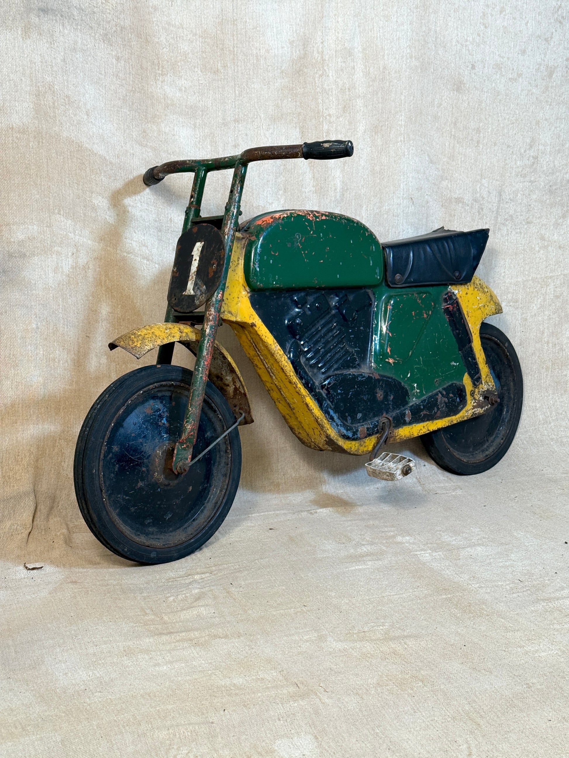 Mobo pressed steel pedal Motorcycle with yellow and green distressed paint. 