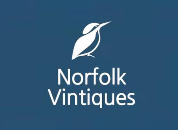 Logo of Norfolk Vintiques with a white bird illustration on a blue background