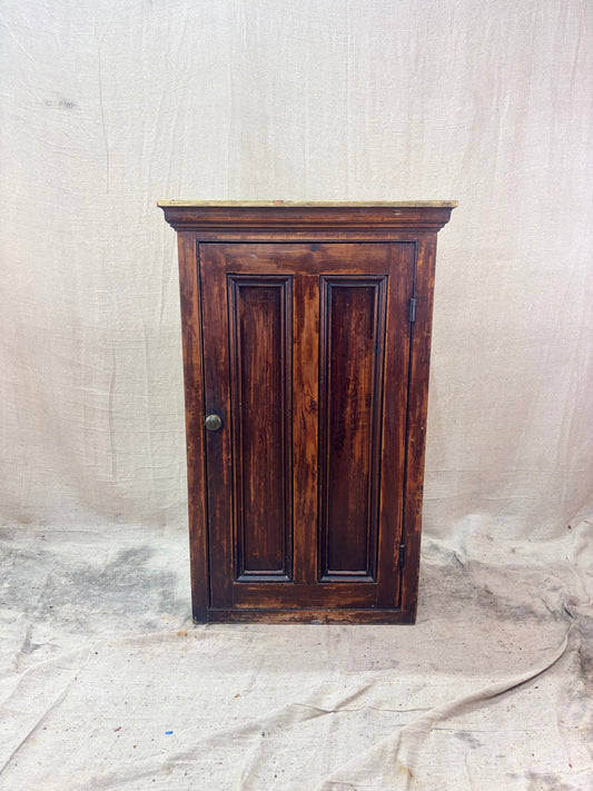 Wooden cabinet with a textured white background