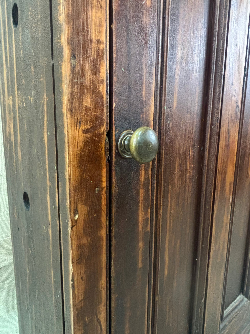 Wooden door with a green doorknob