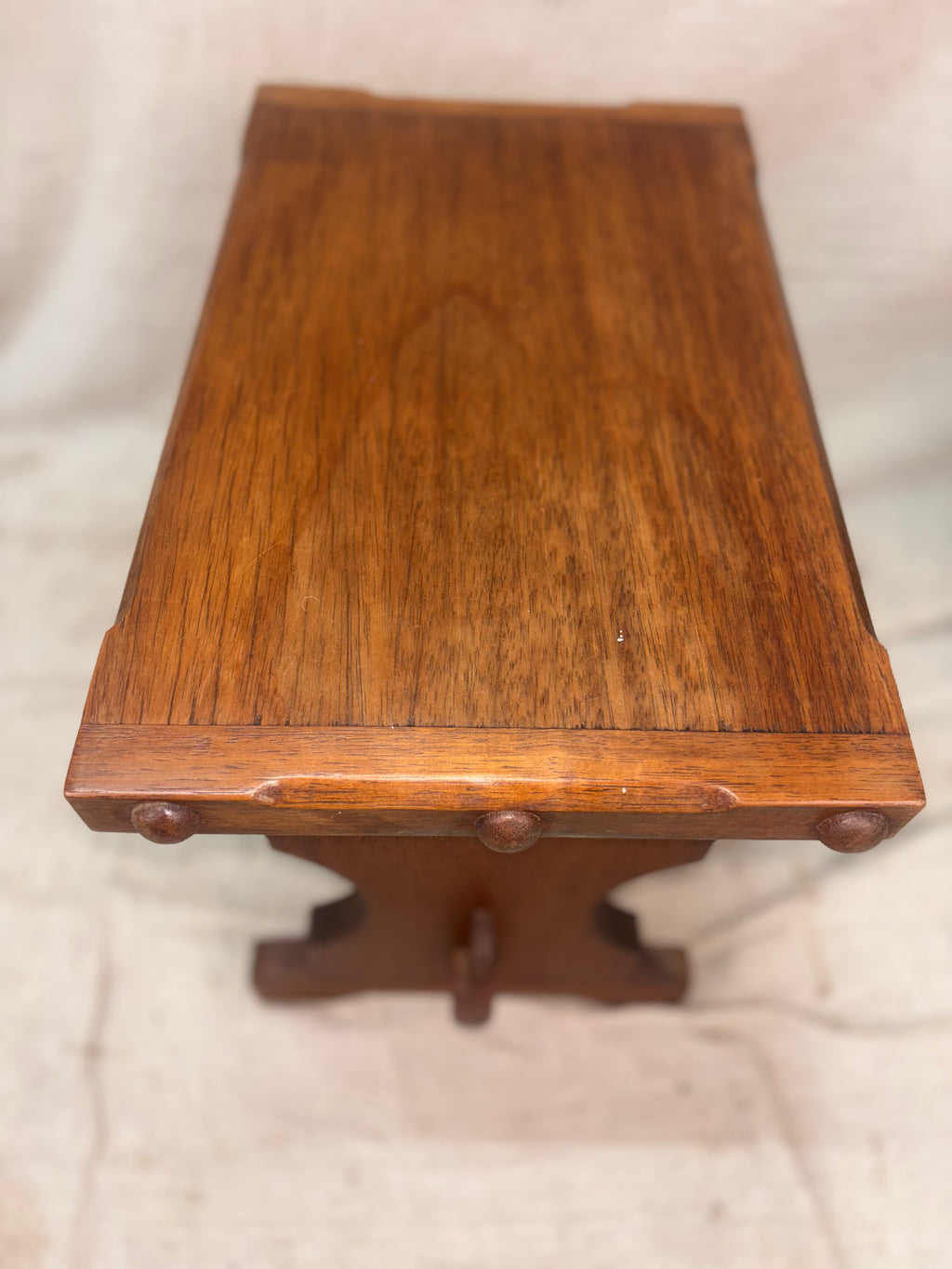Wooden table with a textured surface on a light background