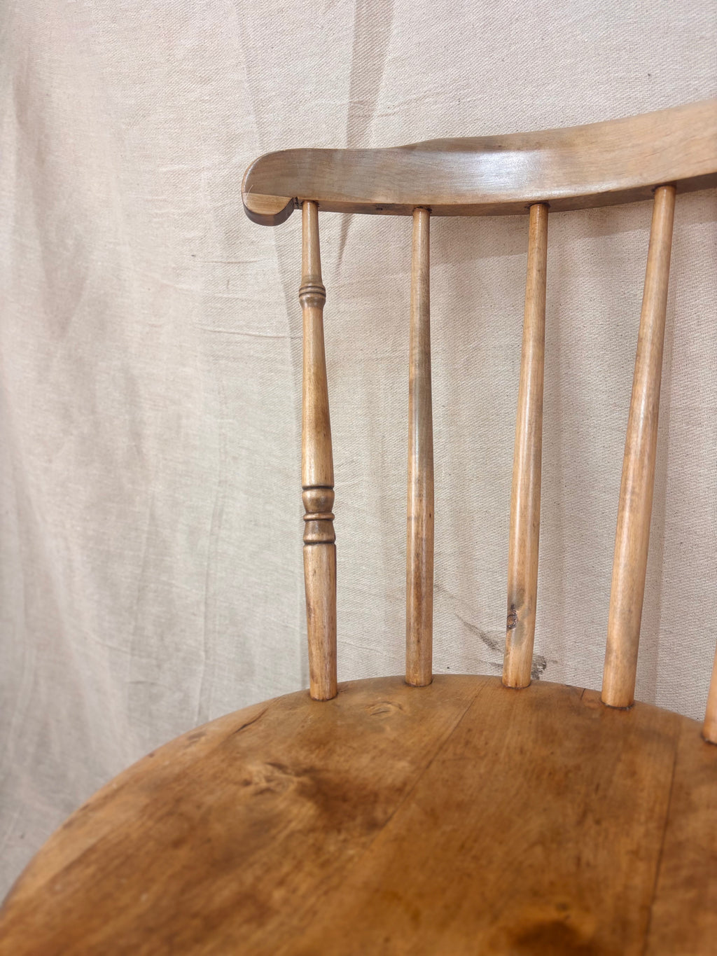 Close up of a stick back chair on a light background