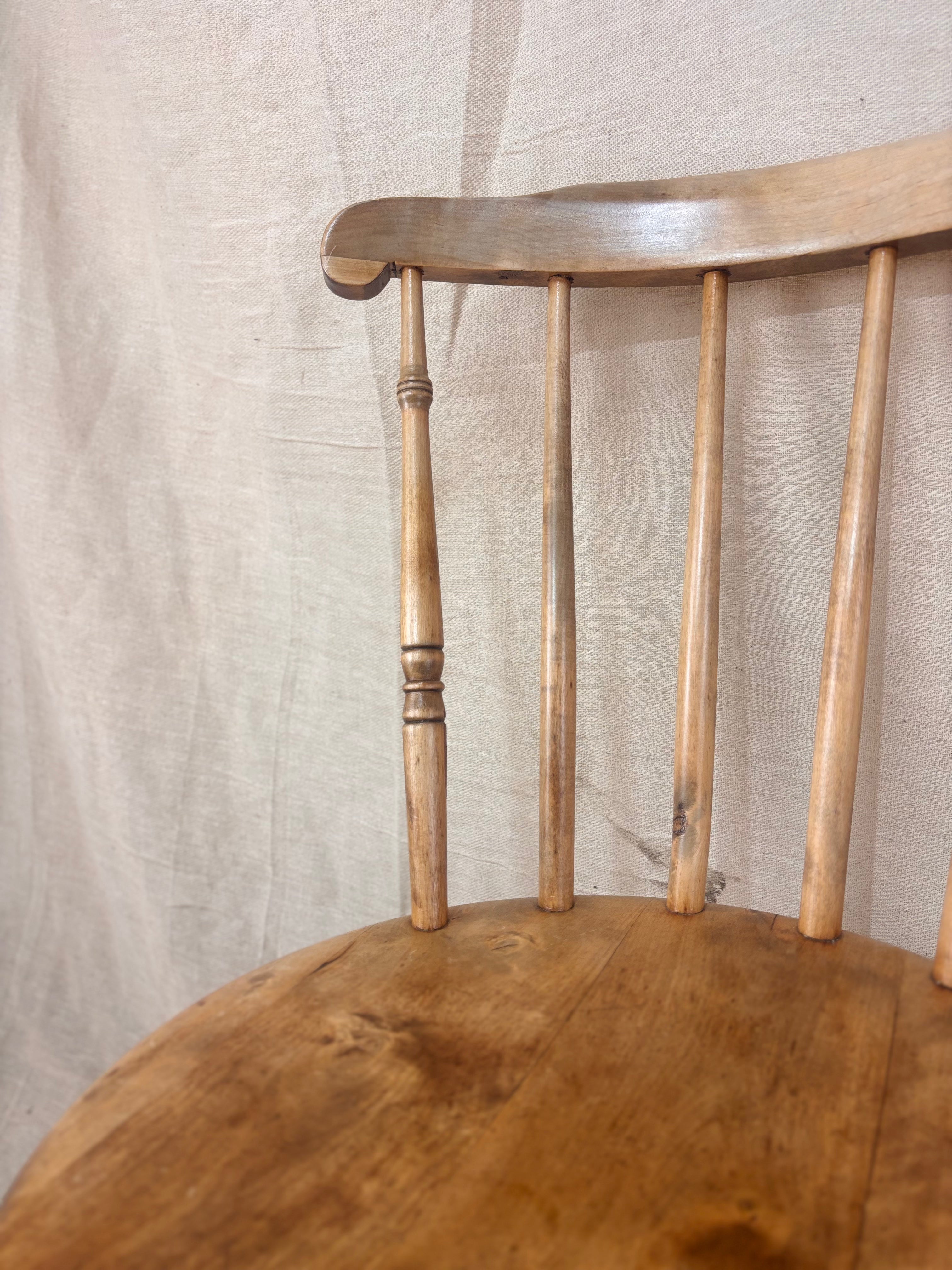 Close up of a stick back chair on a light background