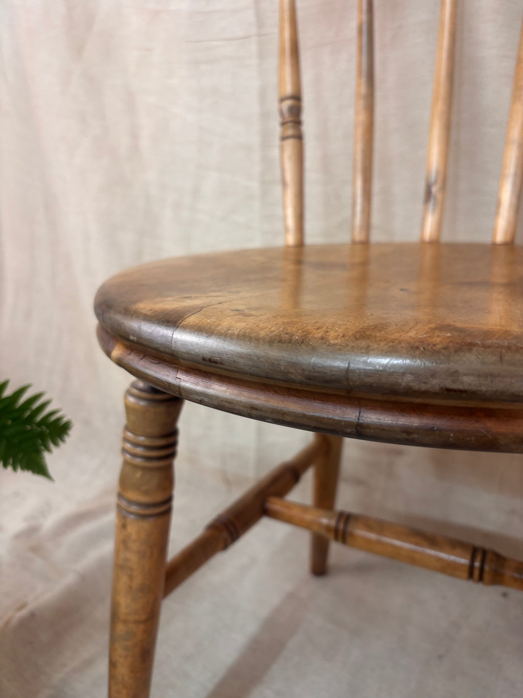 Close up of a wooden chair on a light background