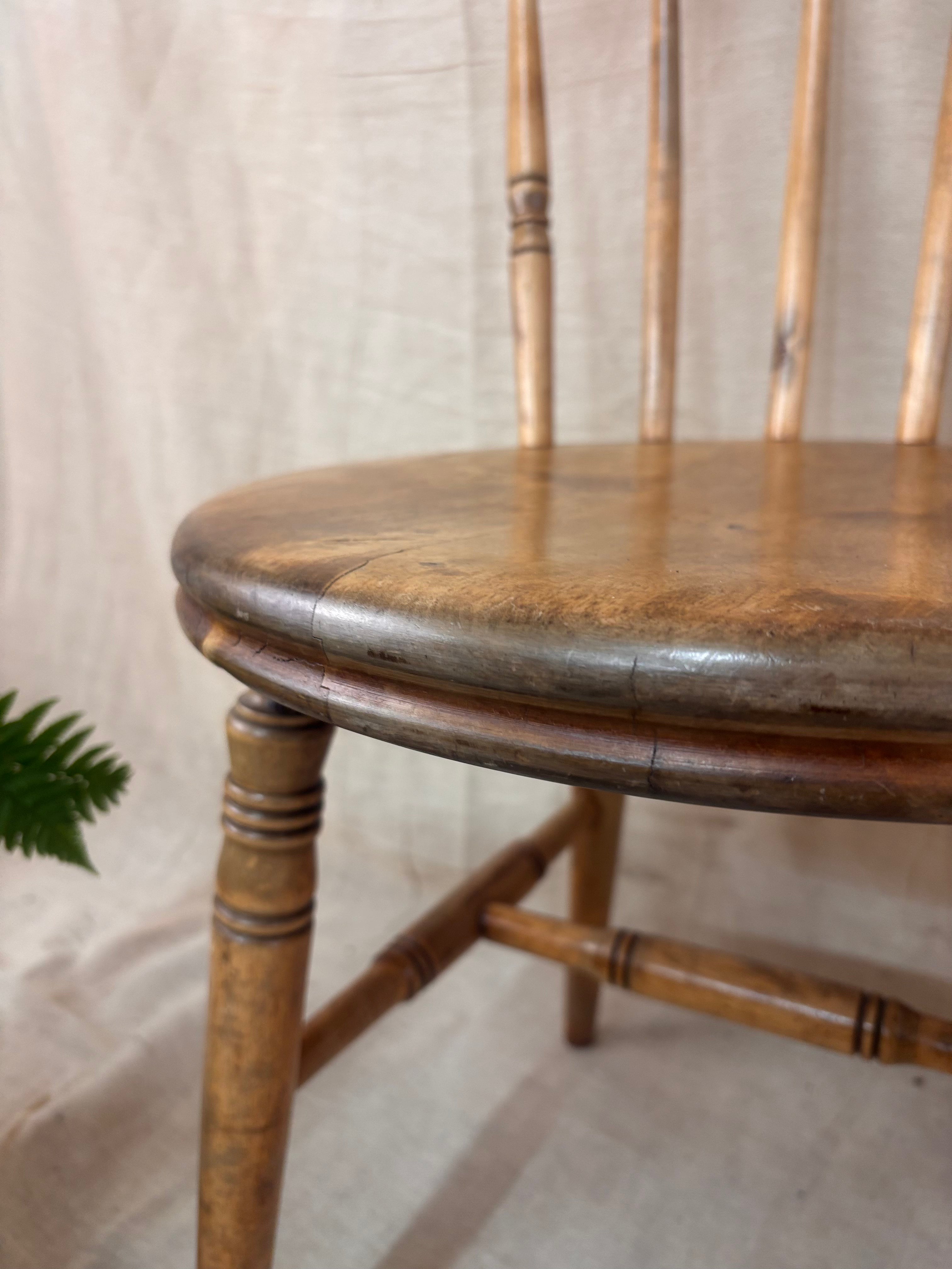 Close up of a wooden chair on a light background