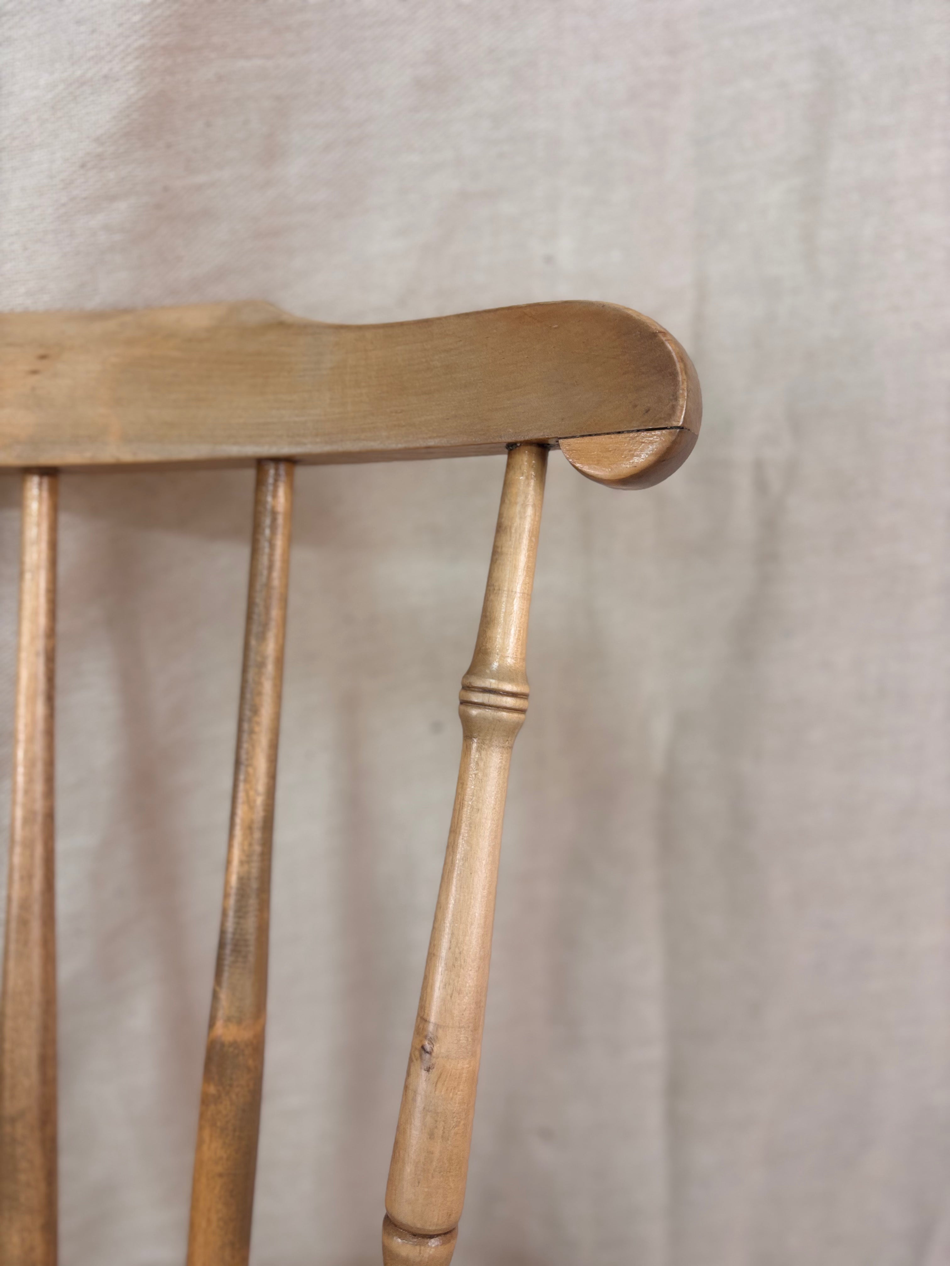 Close-up of a wooden chair with a plain background