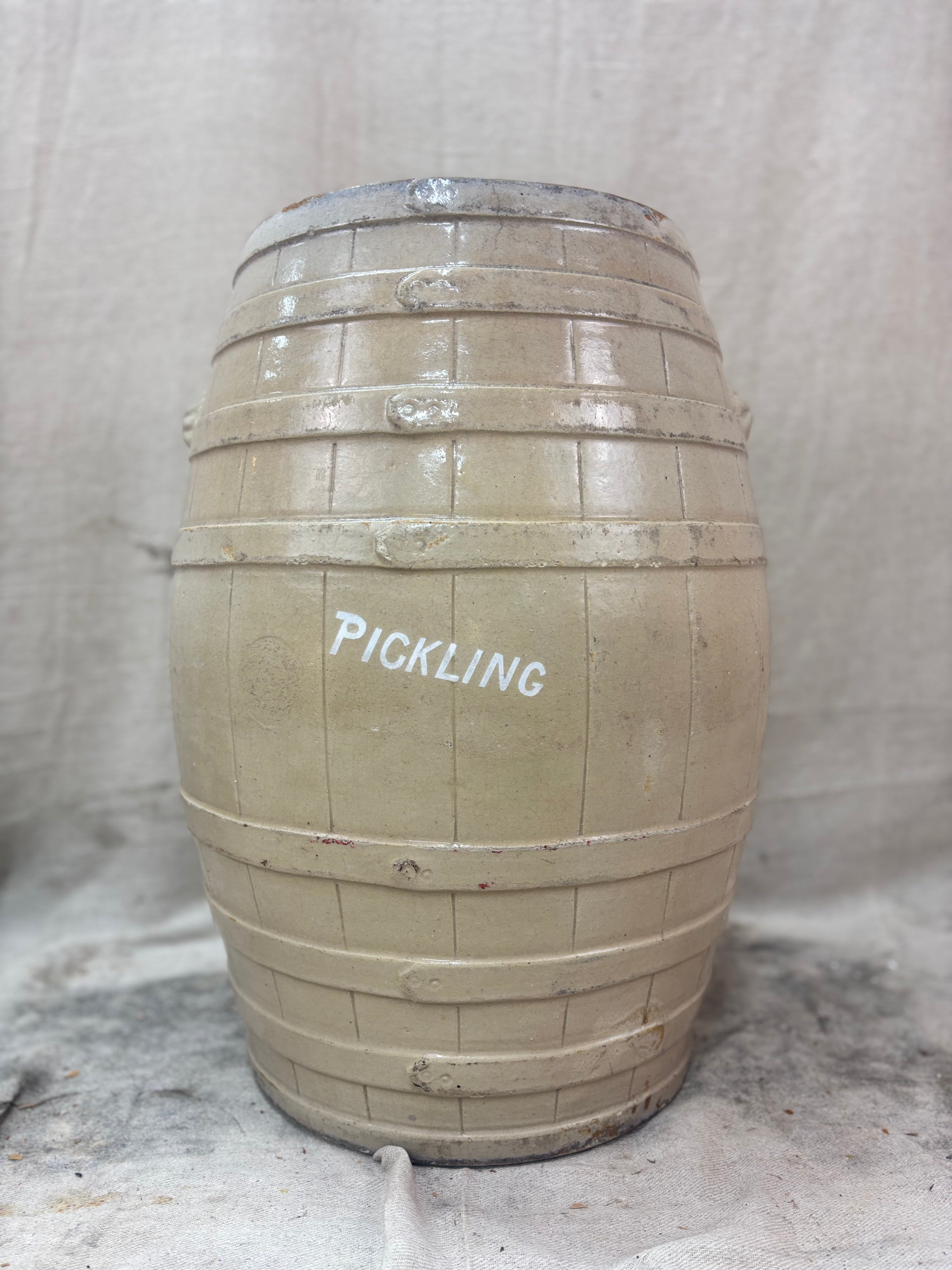 stoneware barrel labeled 'PICKLING' on a textured background
